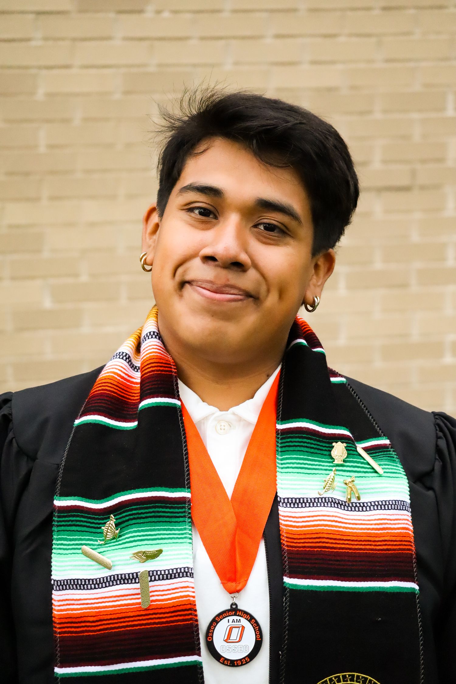 High school graduation portrait. School front.