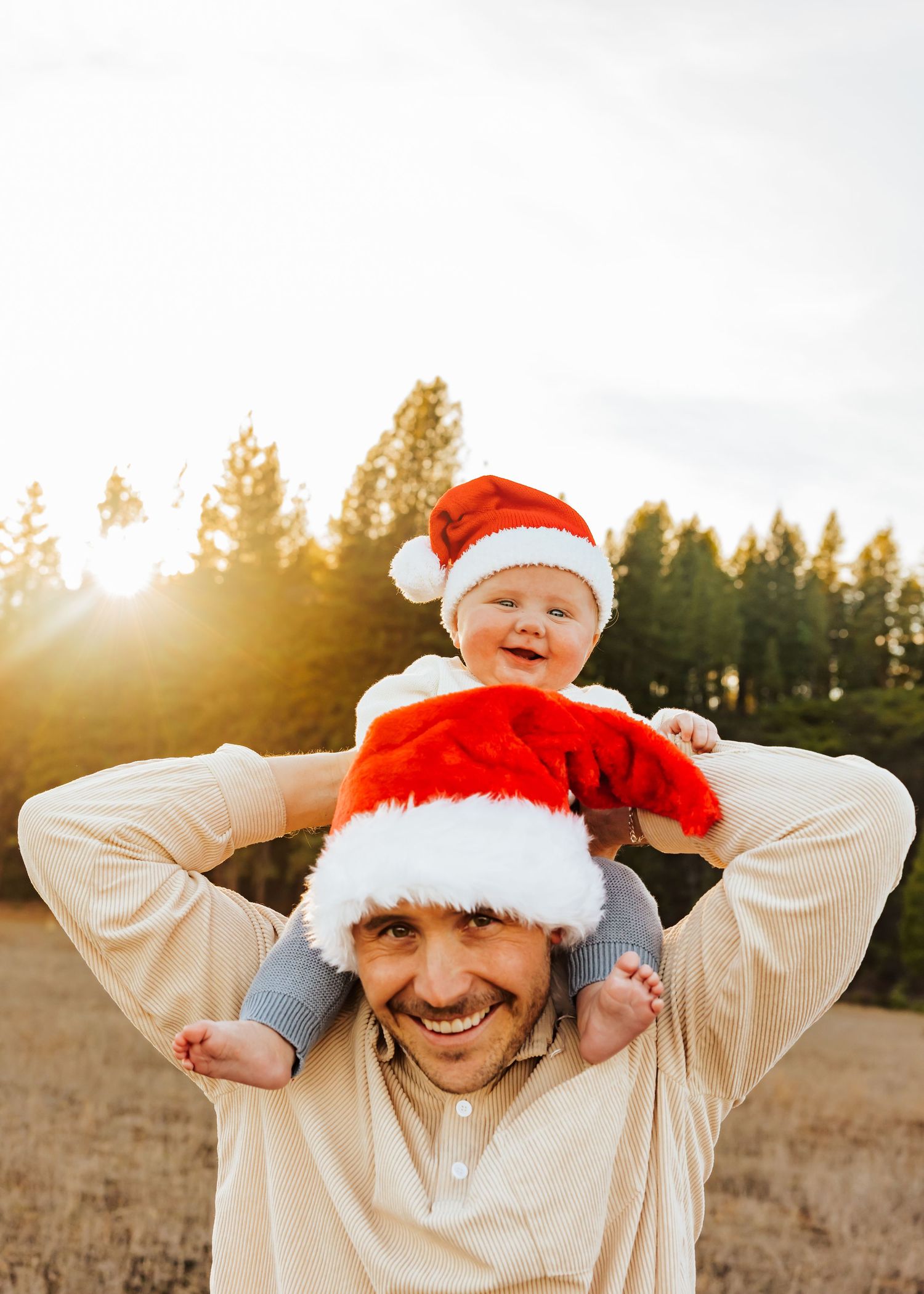 Playful holiday photos with Santa hats against a bright winter sky.