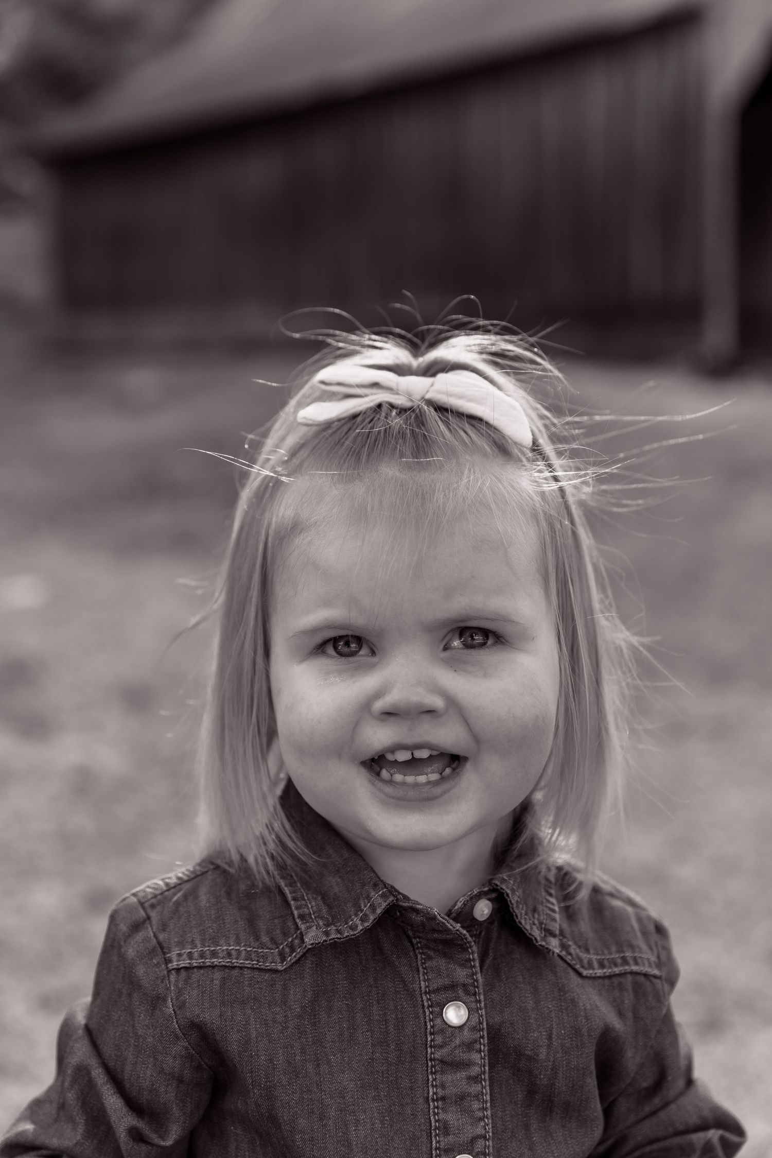 Black and white portrait series showing joyful expressions and denim clothing.
