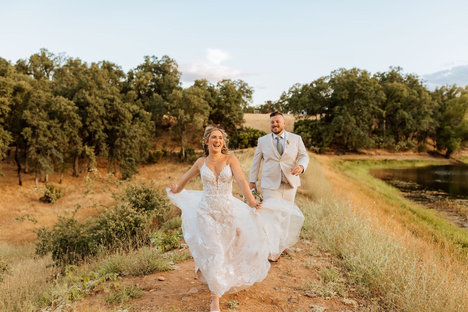 A series of candid wedding photos showing a couple dancing along a lakeside path.