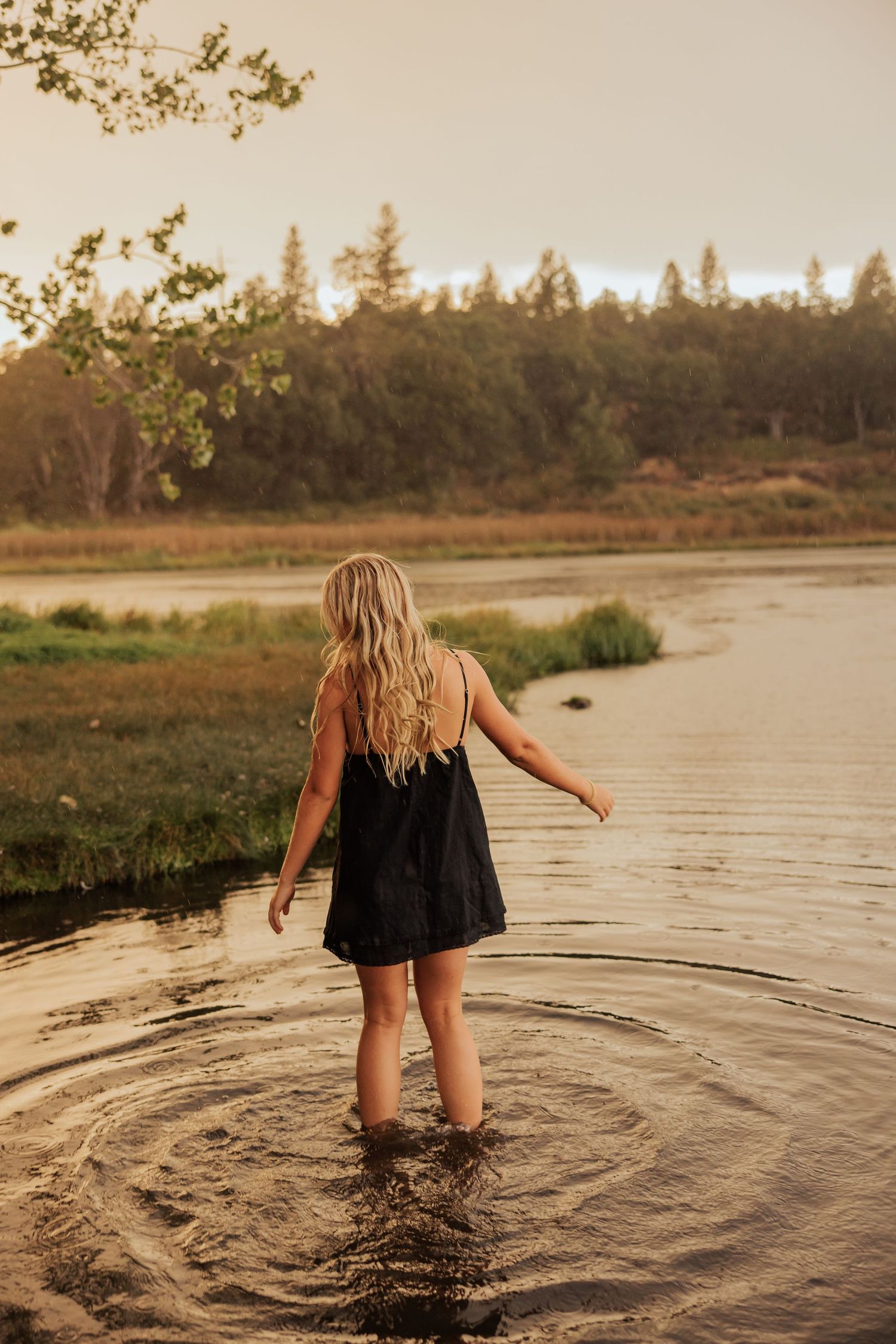 Playful moments at the water's edge during golden hour sunset.