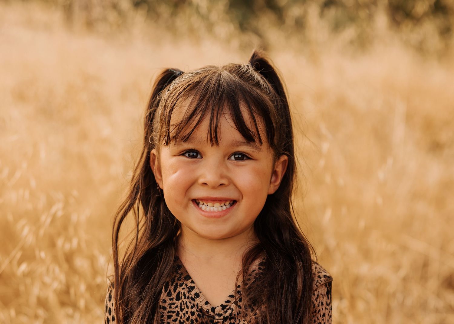 Candid portraits captured in warm golden light during sunset.