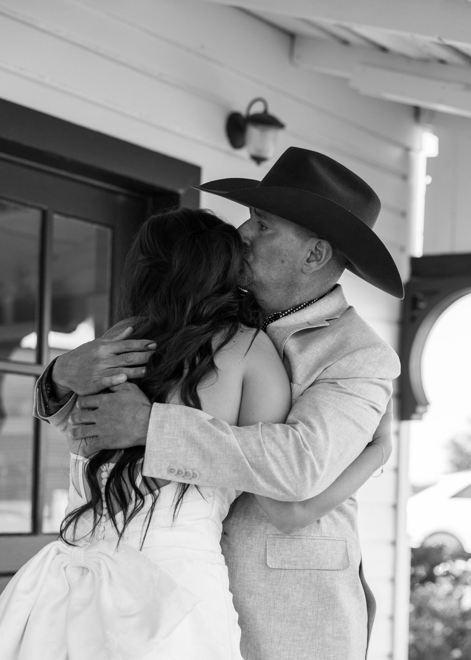 A romantic black and white series of intimate moments on a covered porch.