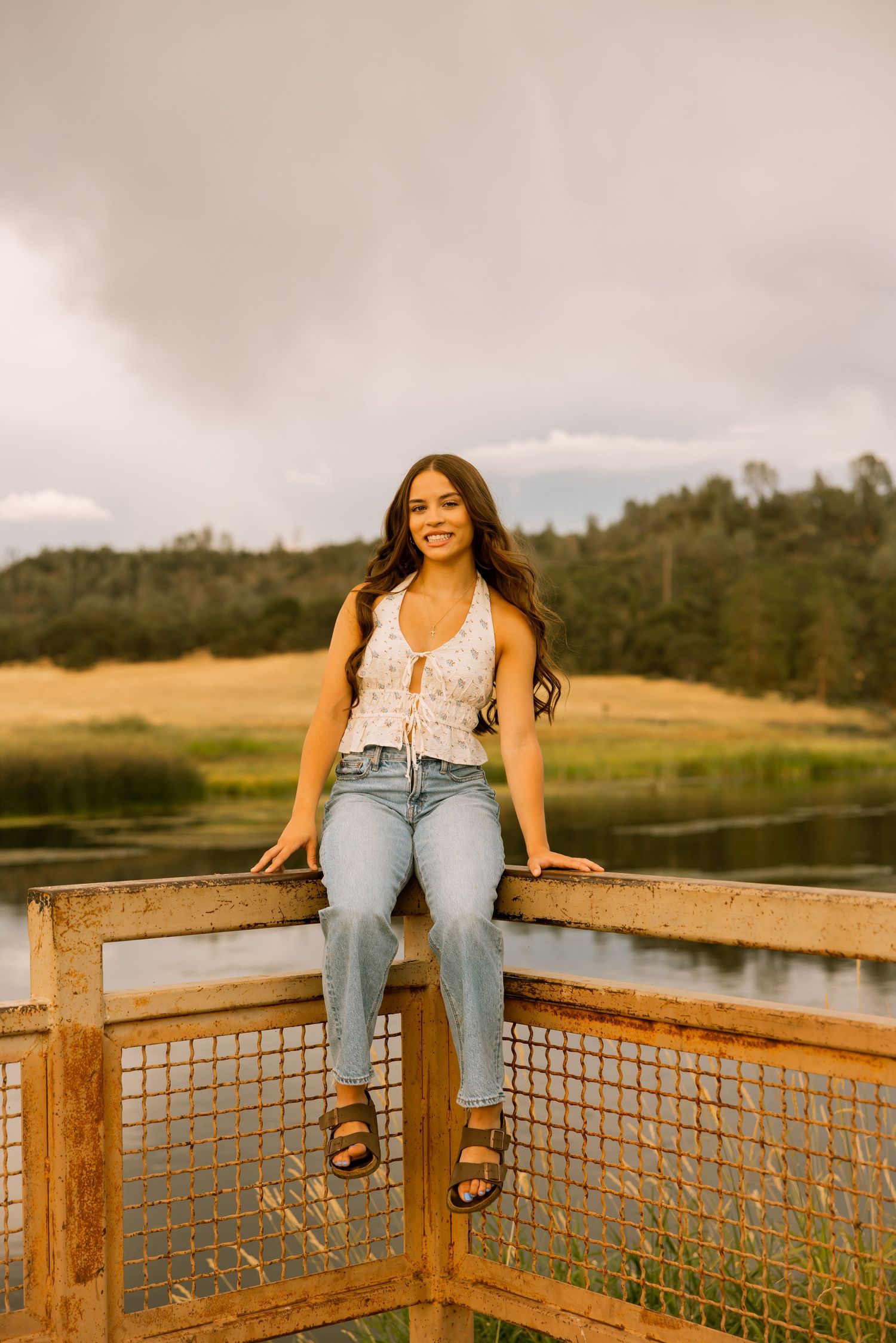 Casual outdoor session on a wooden deck overlooking a scenic mountain lake.