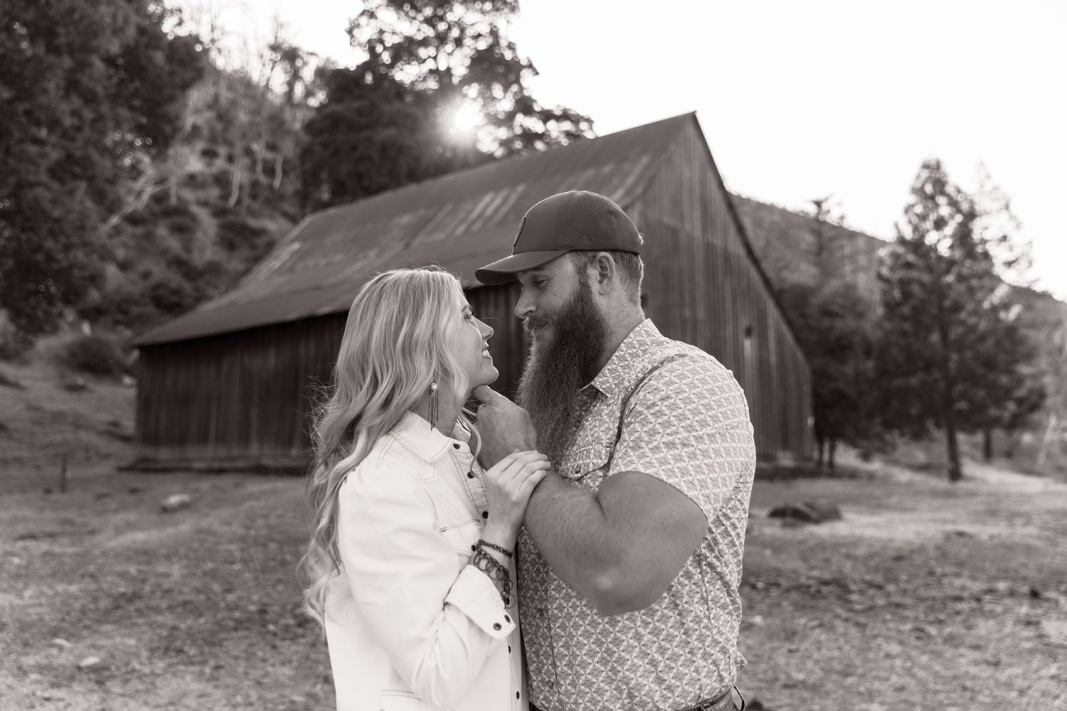 Intimate couple portraits in a rustic outdoor setting with natural lighting.