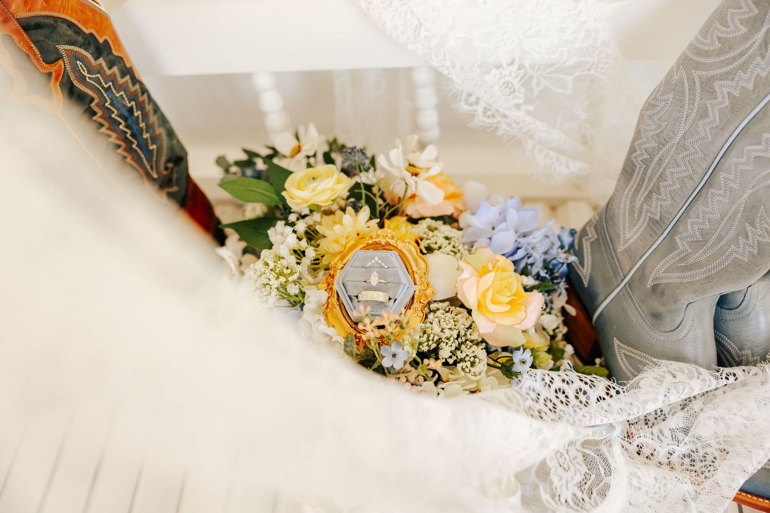 Close-up details of delicate lace and floral wedding accessories with soft lighting.