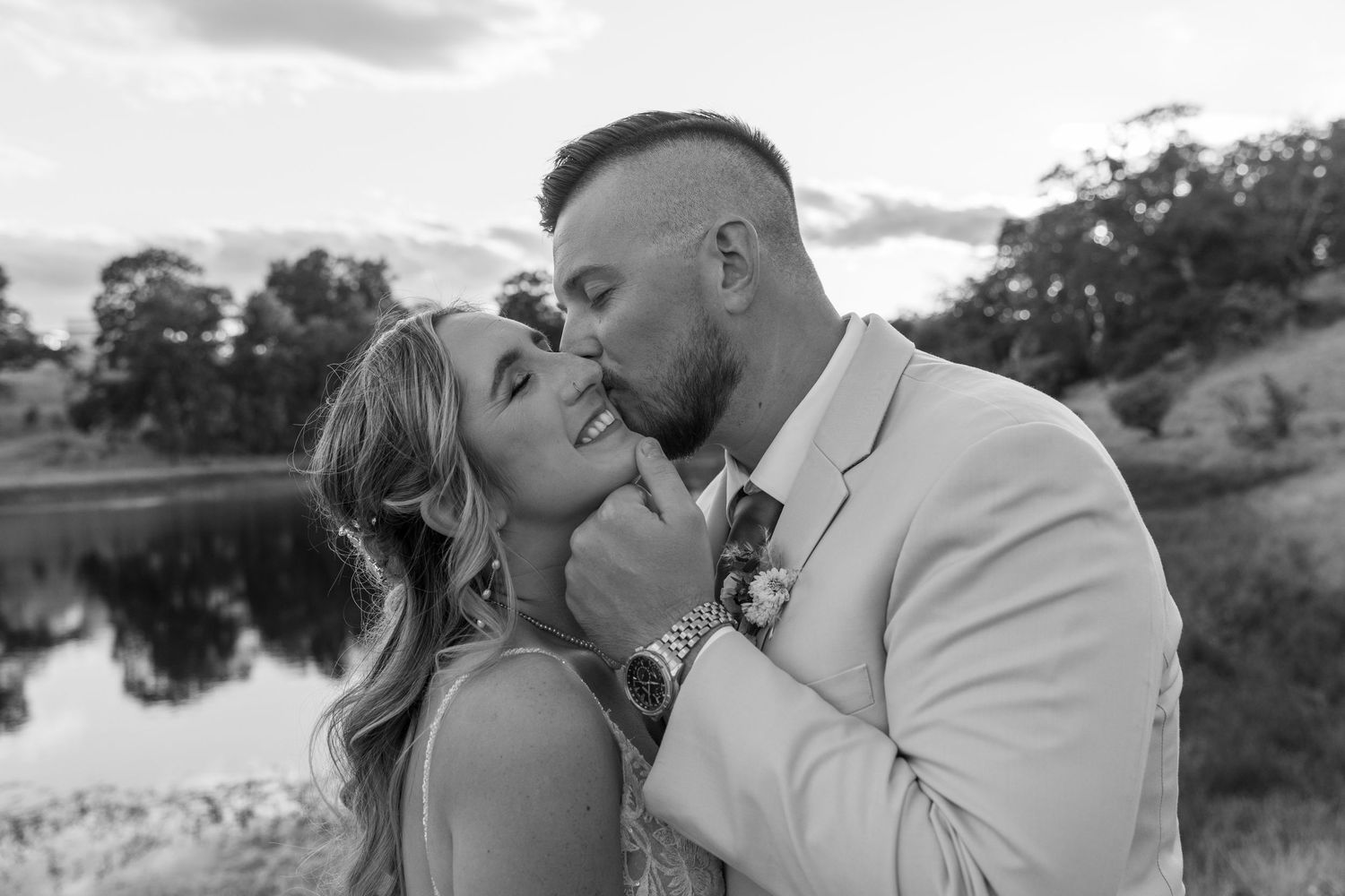 Romantic black and white photos of a couple sharing tender moments during their wedding.