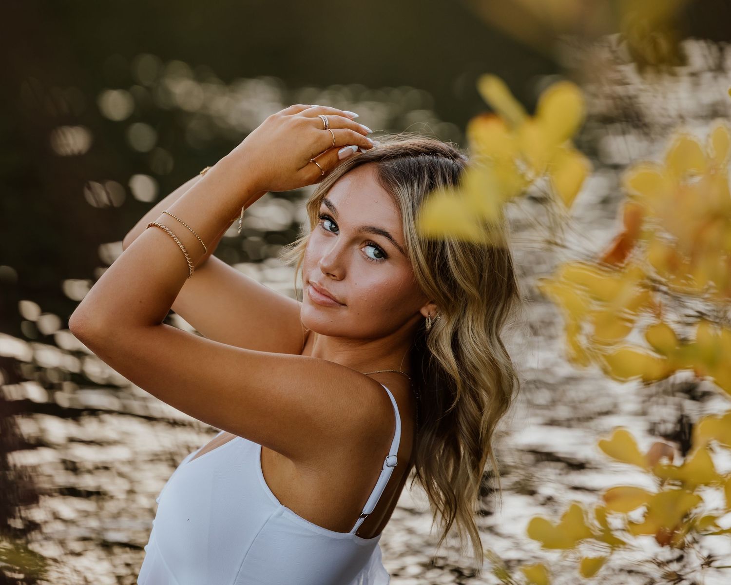 Artistic portrait series in golden light with soft bokeh and yellow foliage.