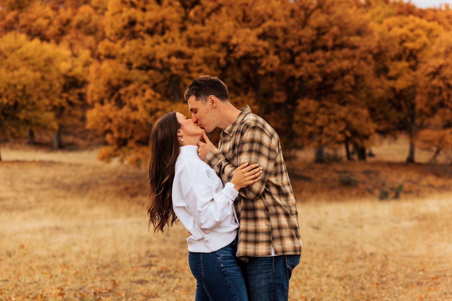 Sweet candid moments captured during an autumn engagement session.