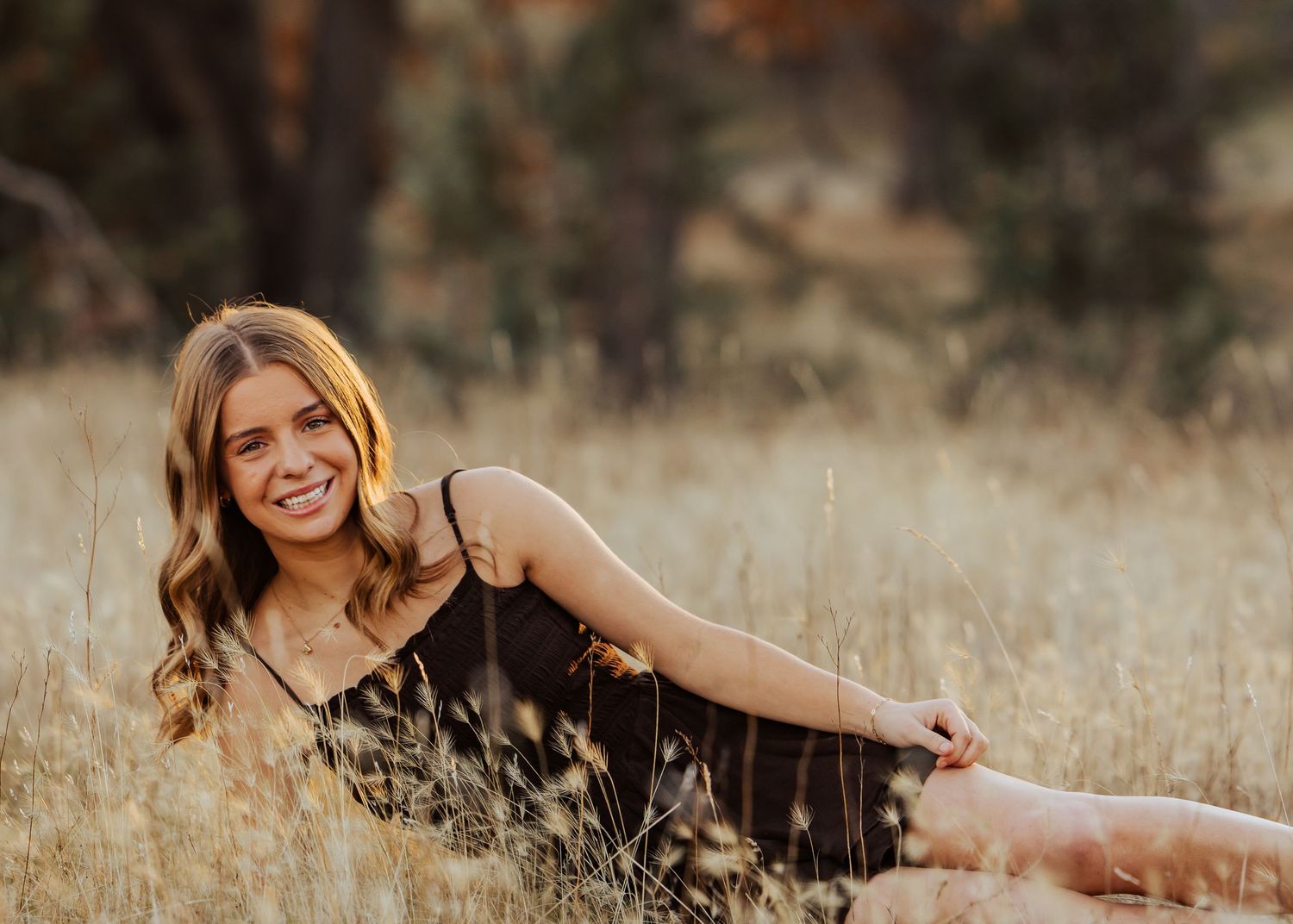 Casual outdoor portrait series with natural poses in warm autumn lighting.