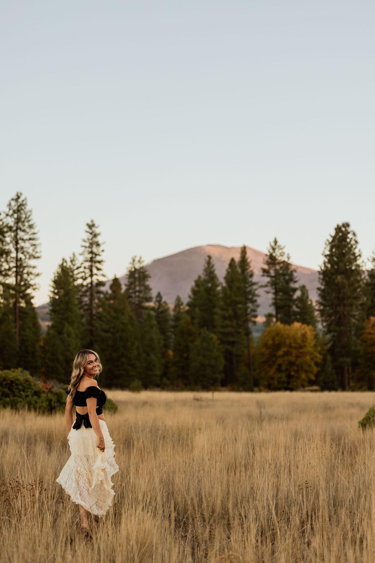 Playful movement captured in a mountain meadow during golden hour.