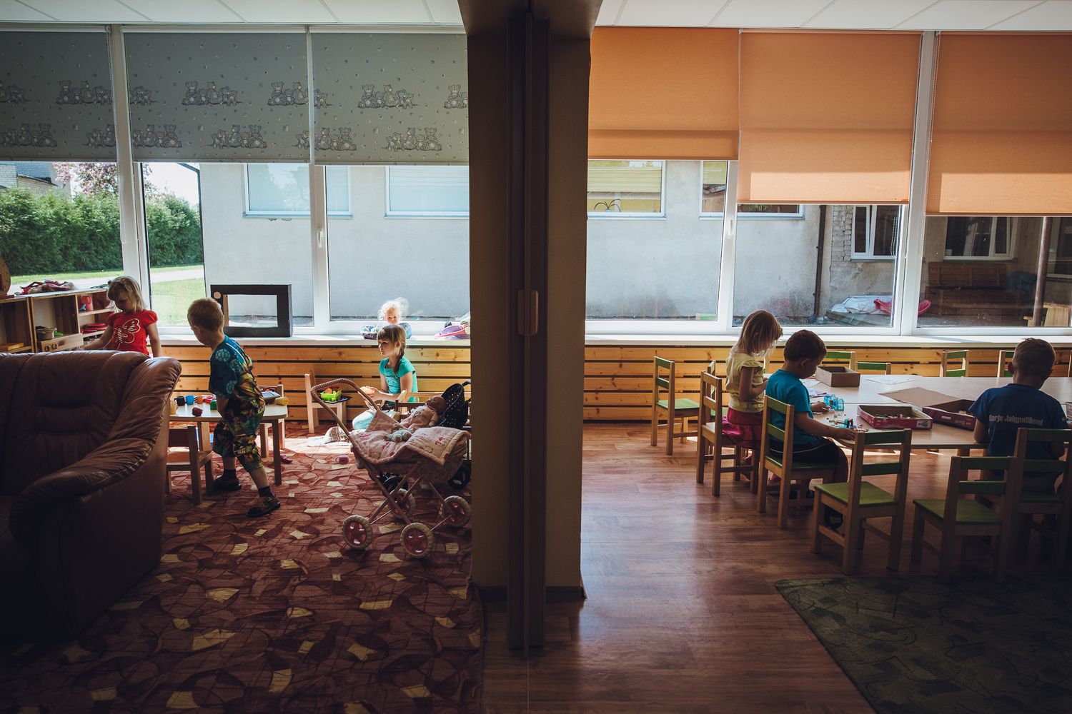 Students seated at tables in a cafeteria during lunchtime.