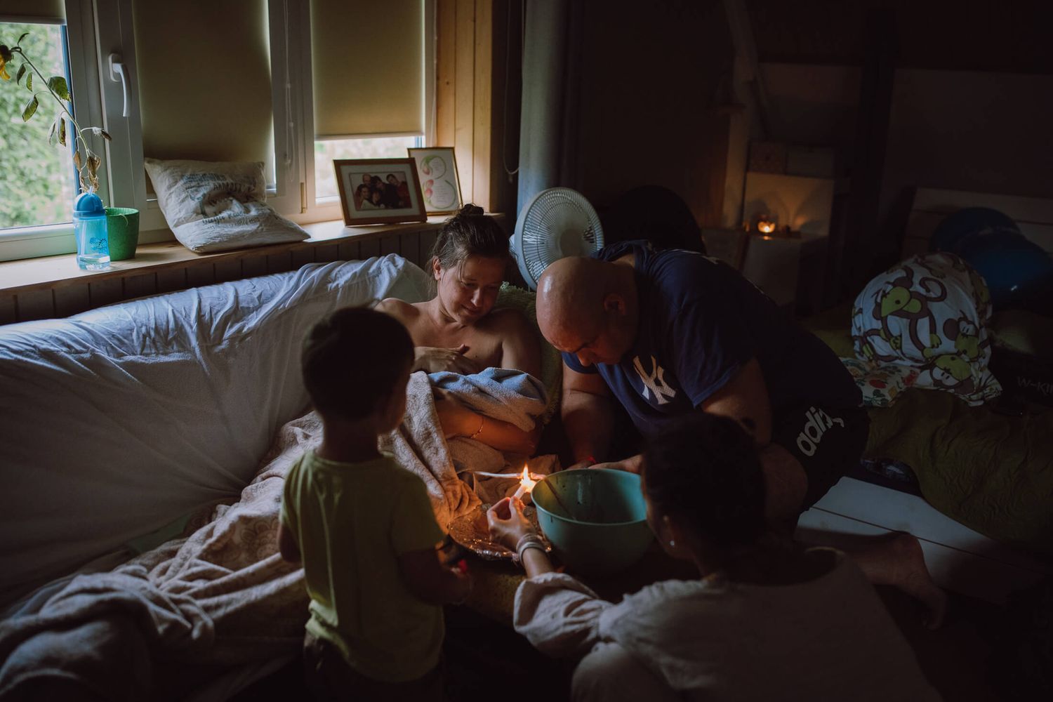 Documentary style photos showing daily life and tender moments at home.