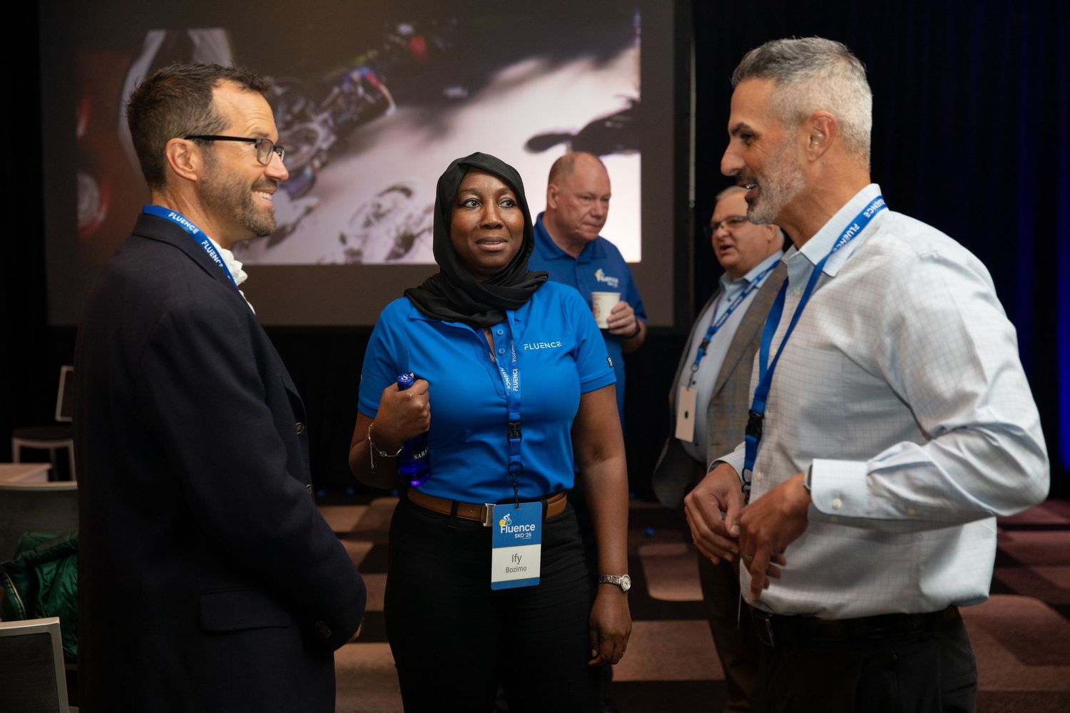 Healthcare professionals engage in discussions and networking during a medical conference or meeting.