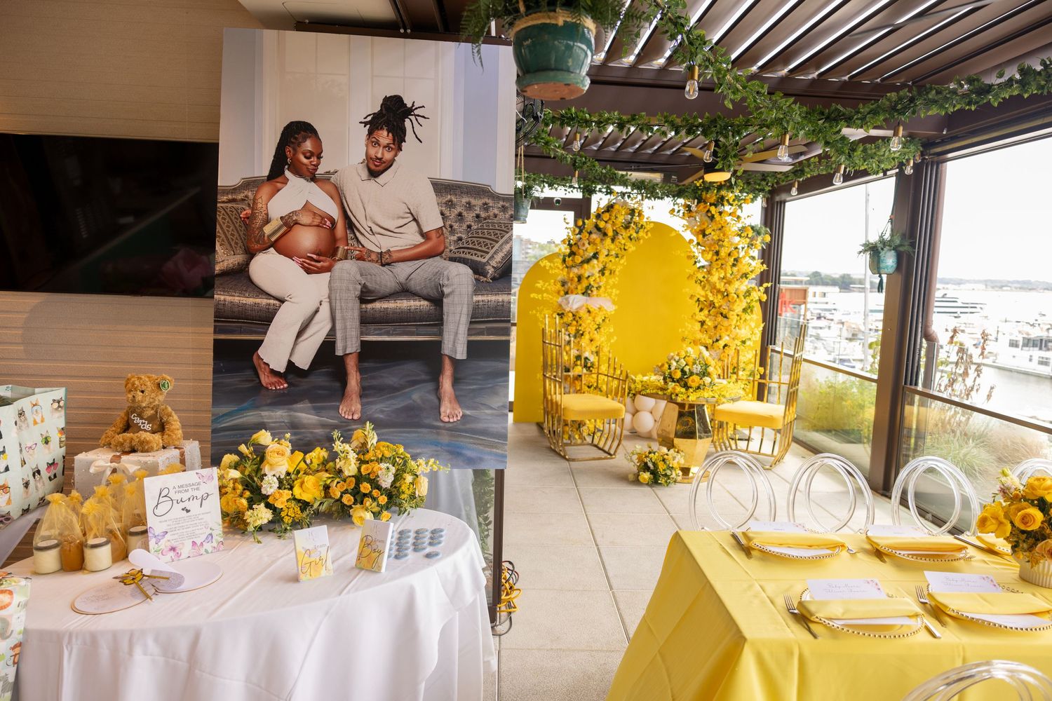 Elegant white and gold table settings at an outdoor event venue with natural lighting.