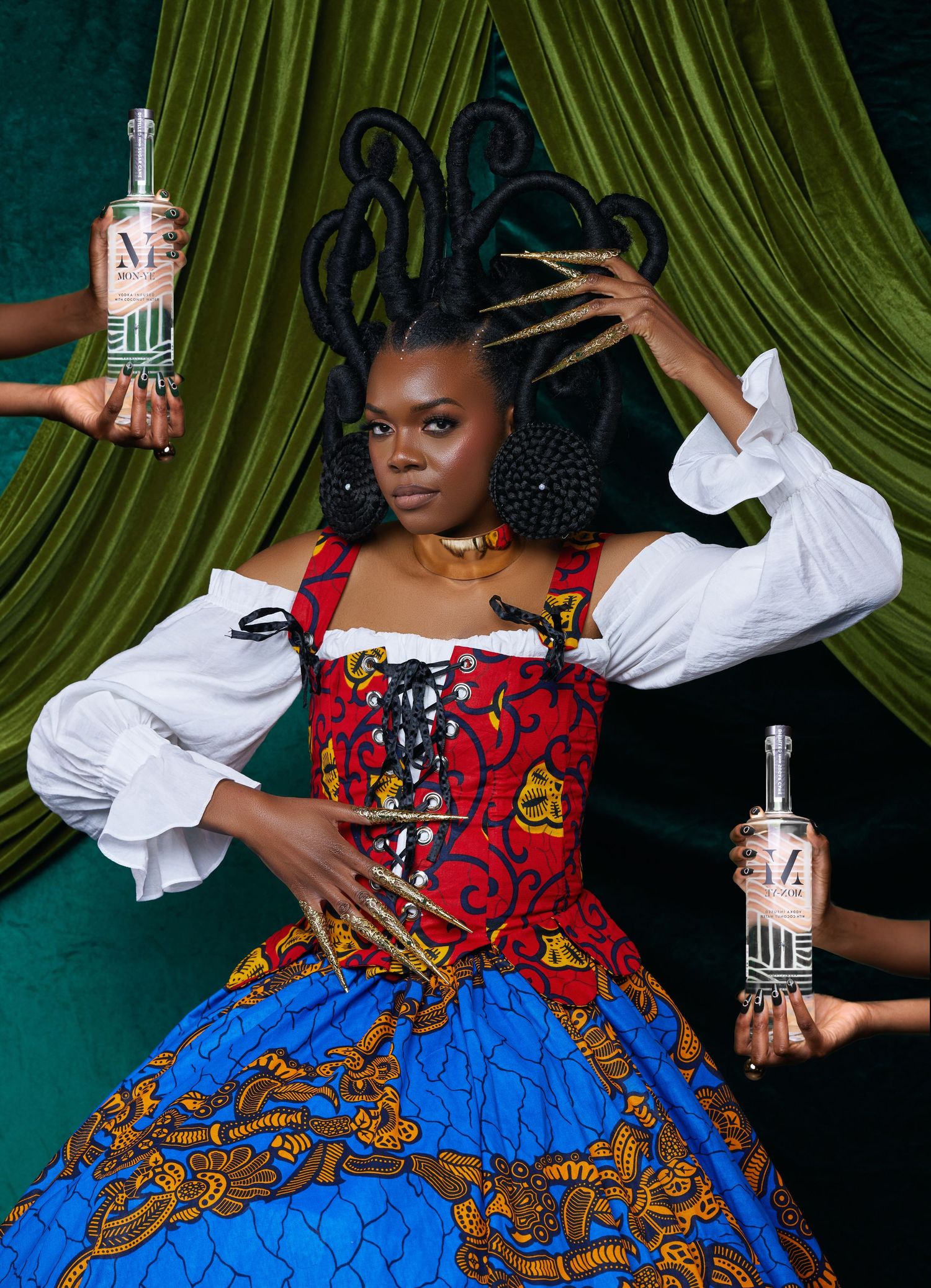 Colorful costume photoshoot with blue and red dress against green velvet curtains.