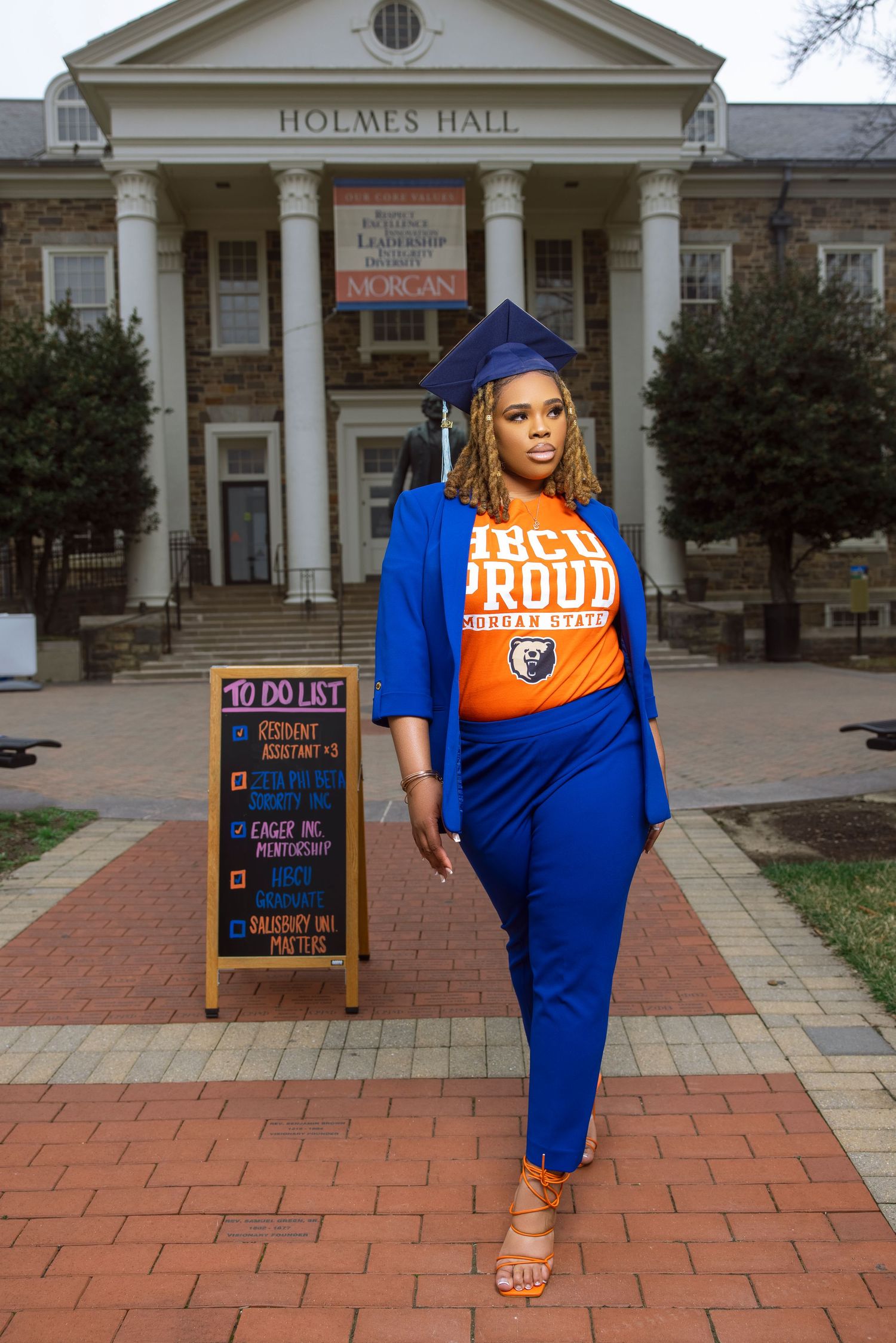 A graduation photo sequence showing a graduate in blue cap and gown walking along a brick pathway near Holmes Hall.