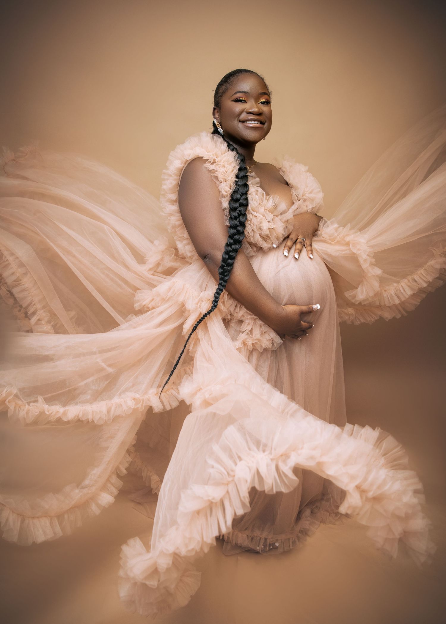 Dancer in a flowing peach tulle dress creates an ethereal movement sequence captured in multiple exposure photography.