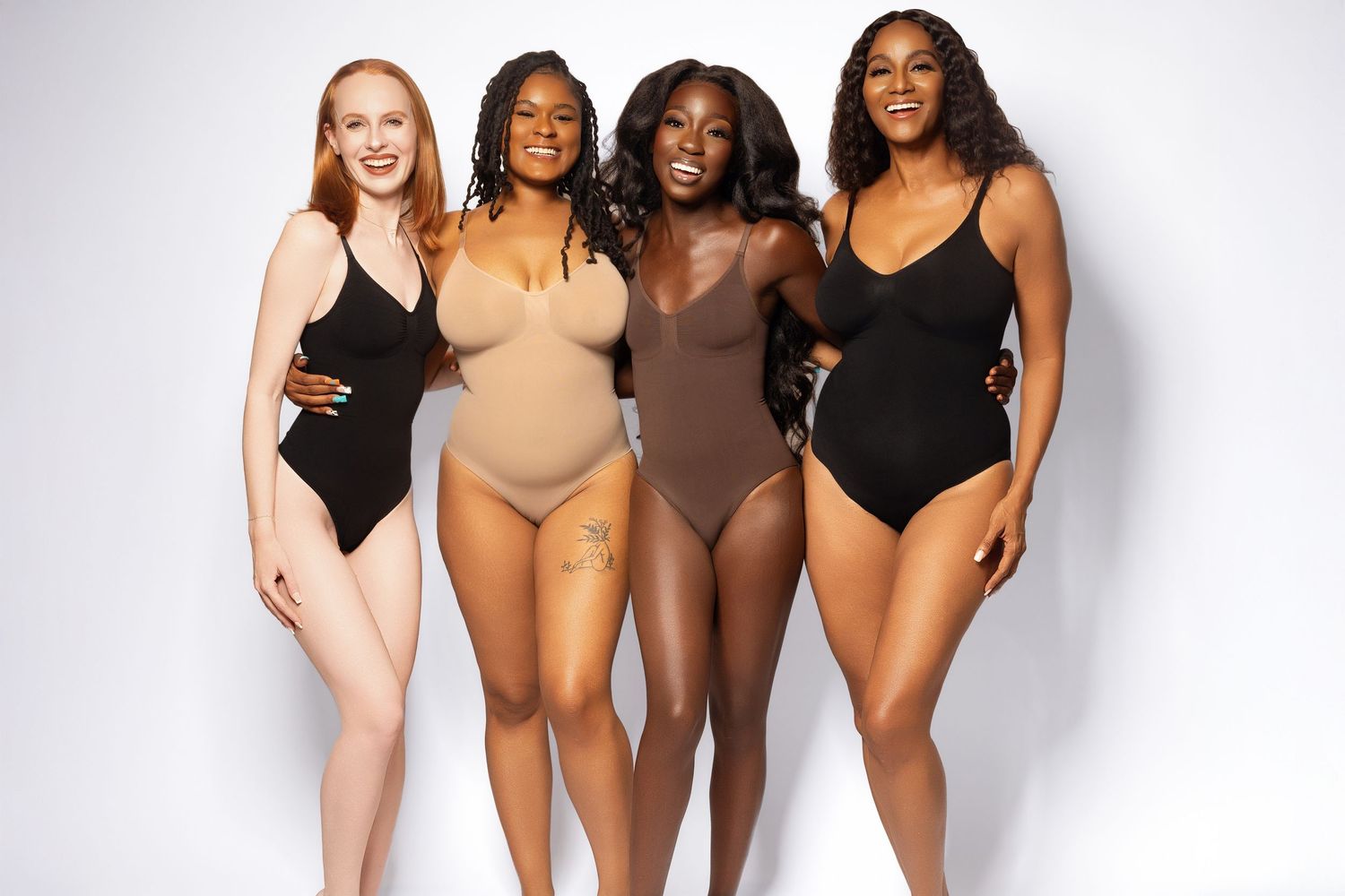 Body positive swimwear campaign showing diverse models in neutral colored swimsuits.
