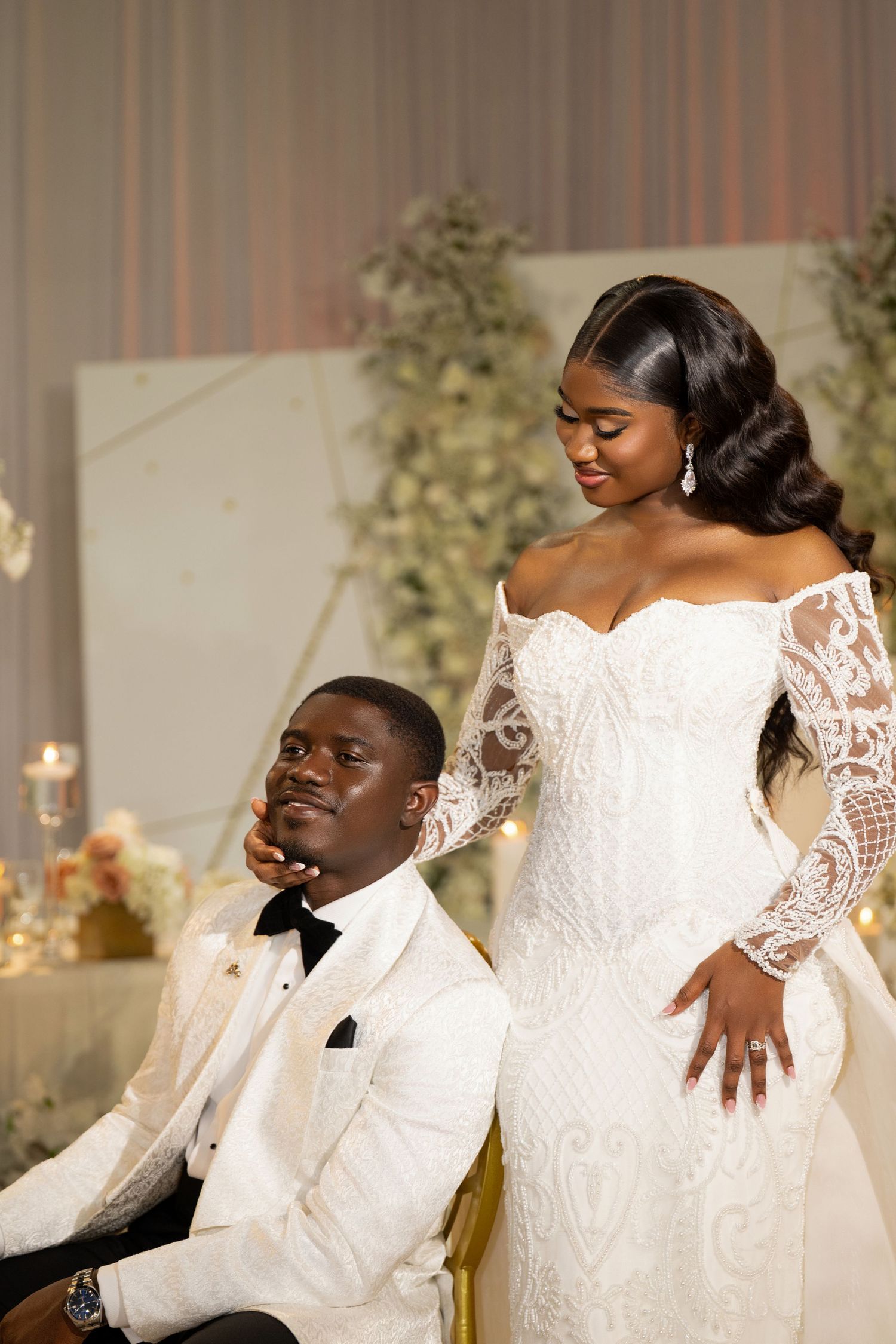 Intimate wedding portrait with couple in white formal attire.