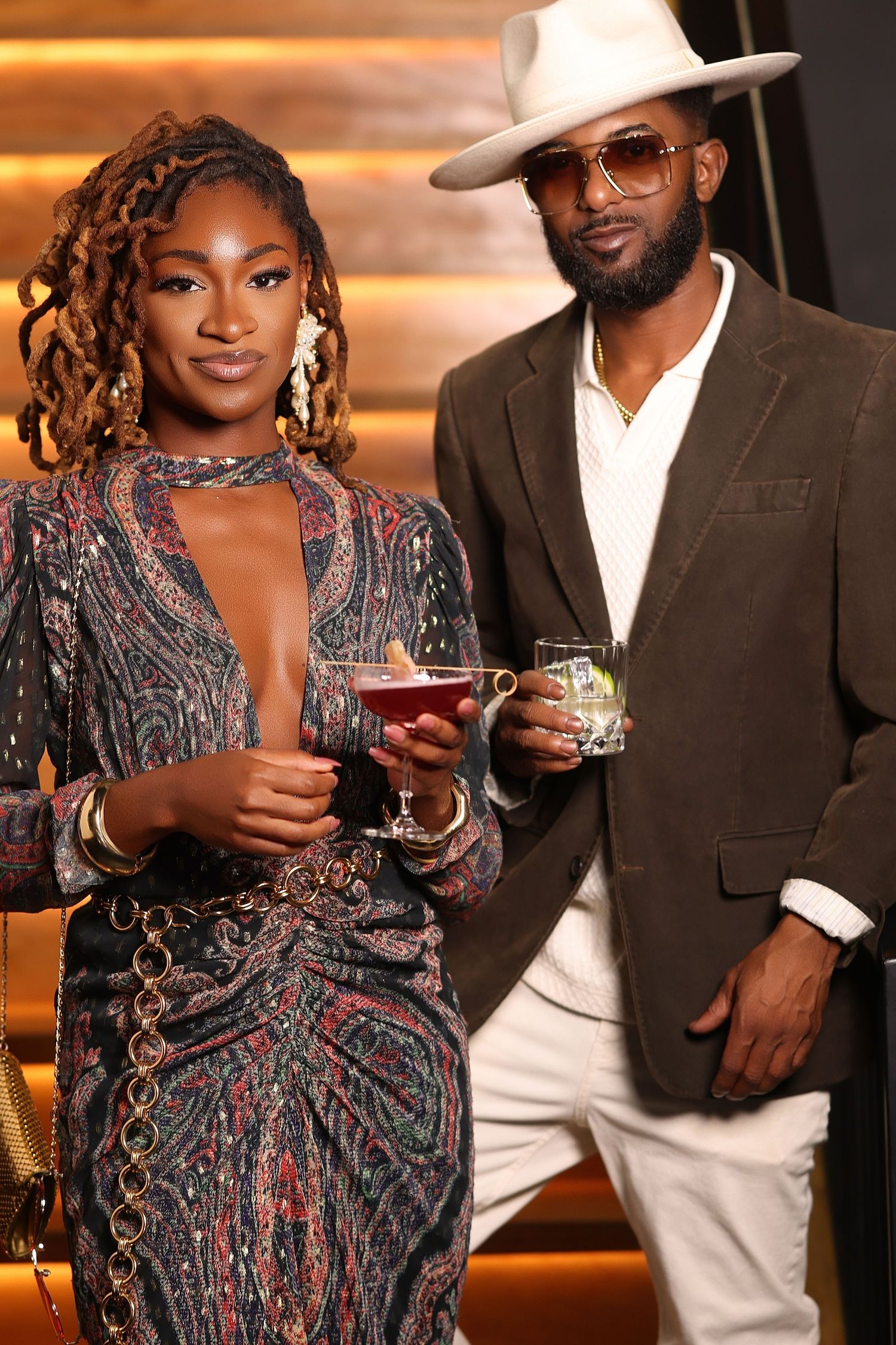 Stylish bar scene with cocktails and elegant evening attire.