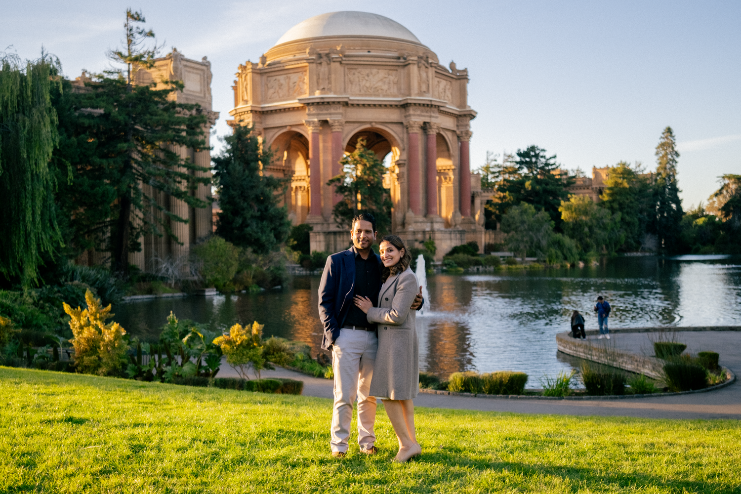 Sunset engagement photo at Palace of Fine Arts with iconic architecture and reflection pond.