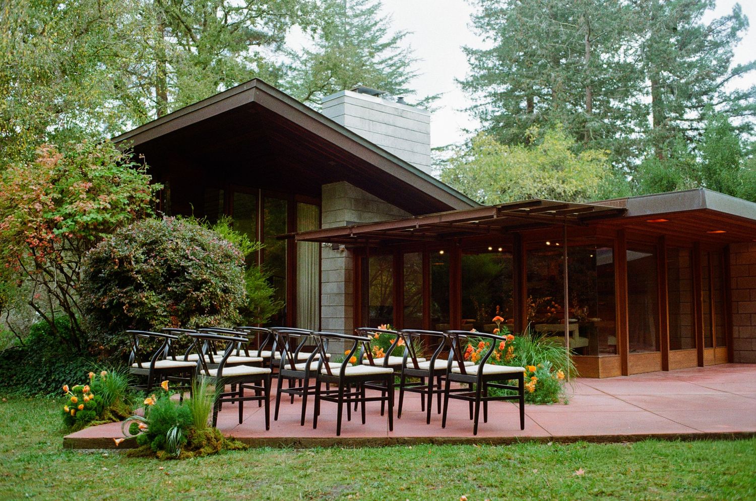 Intimate wedding ceremony setup in front of Frank Lloyd Wright House.