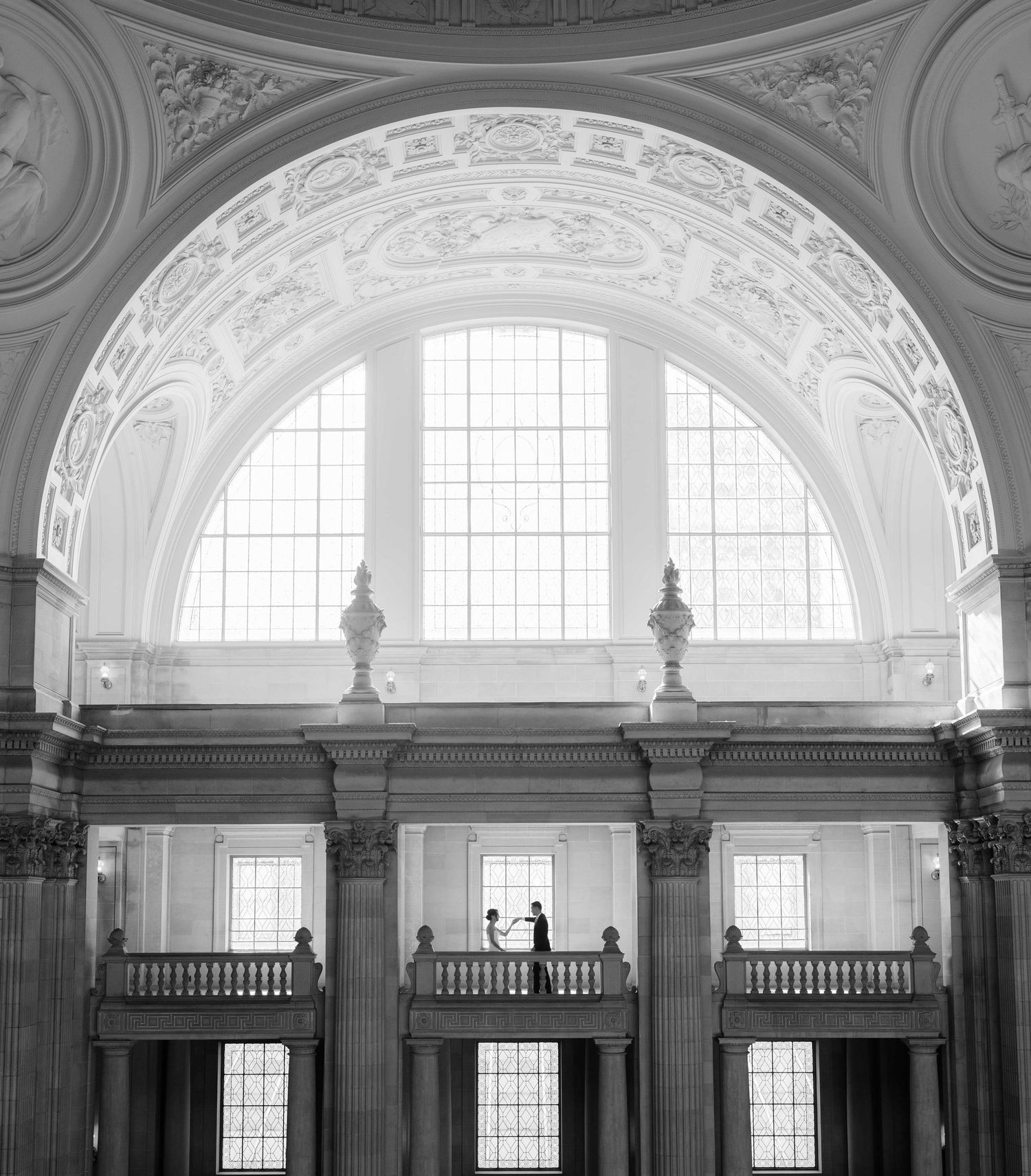 Couple on the Fourth Floor in San Francisco City Hall from far away.