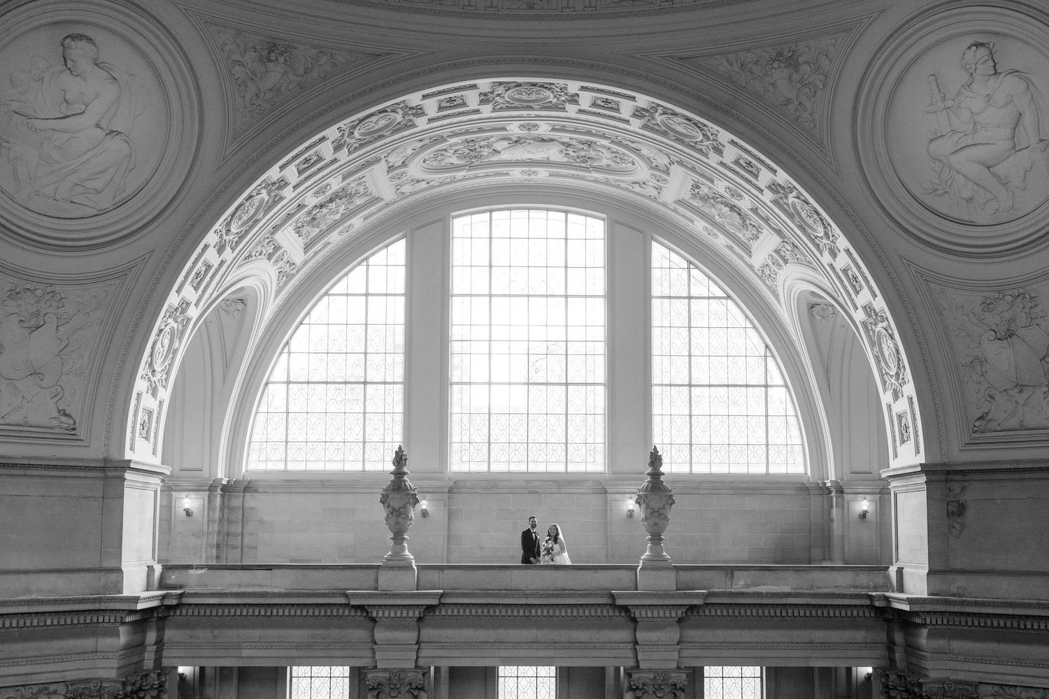 Far away shot of Wedding Couple on the Fourth Floor of SF City Hall.