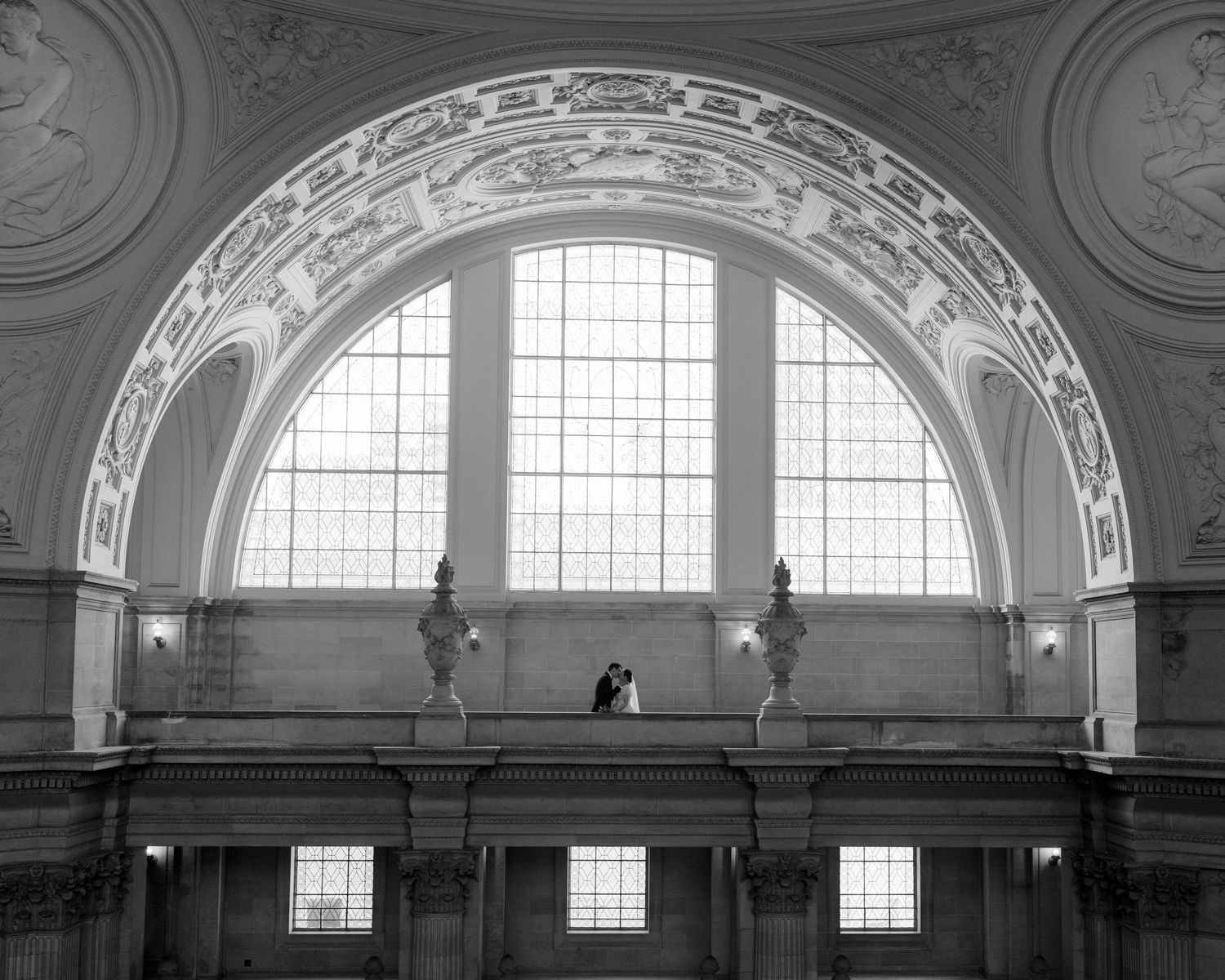 Couple on the Fourth Floor in San Francisco City Hall from far away.