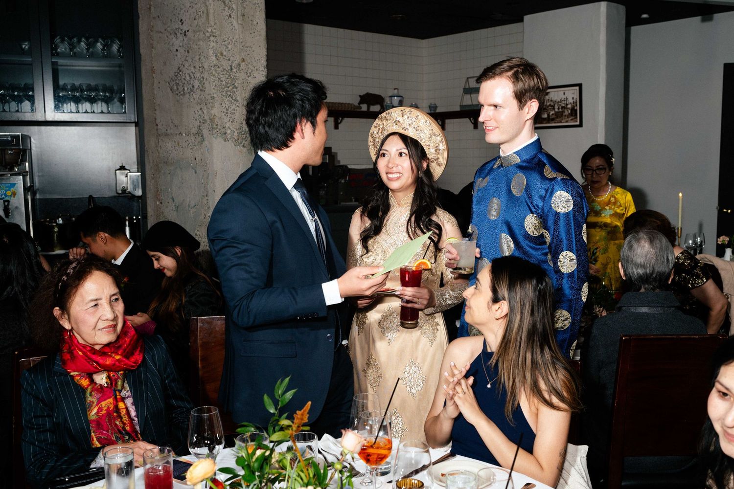 Guests enjoying conversation and drinks at an elegant indoor reception.