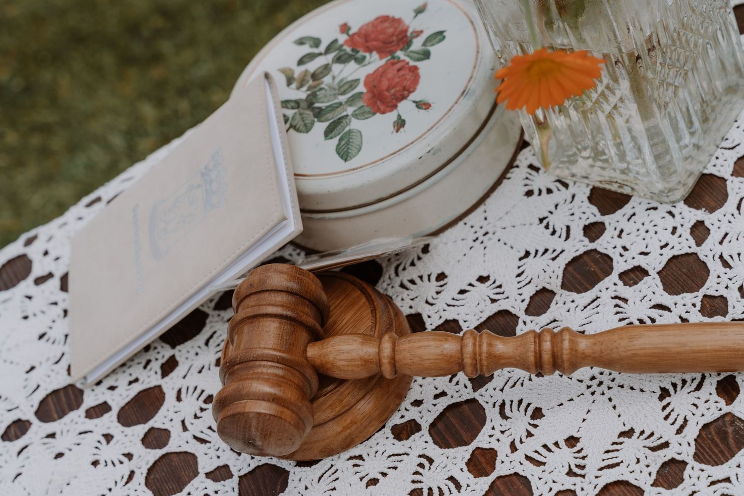 Wedding details featuring lace doilies and decorative elements on a rustic surface.