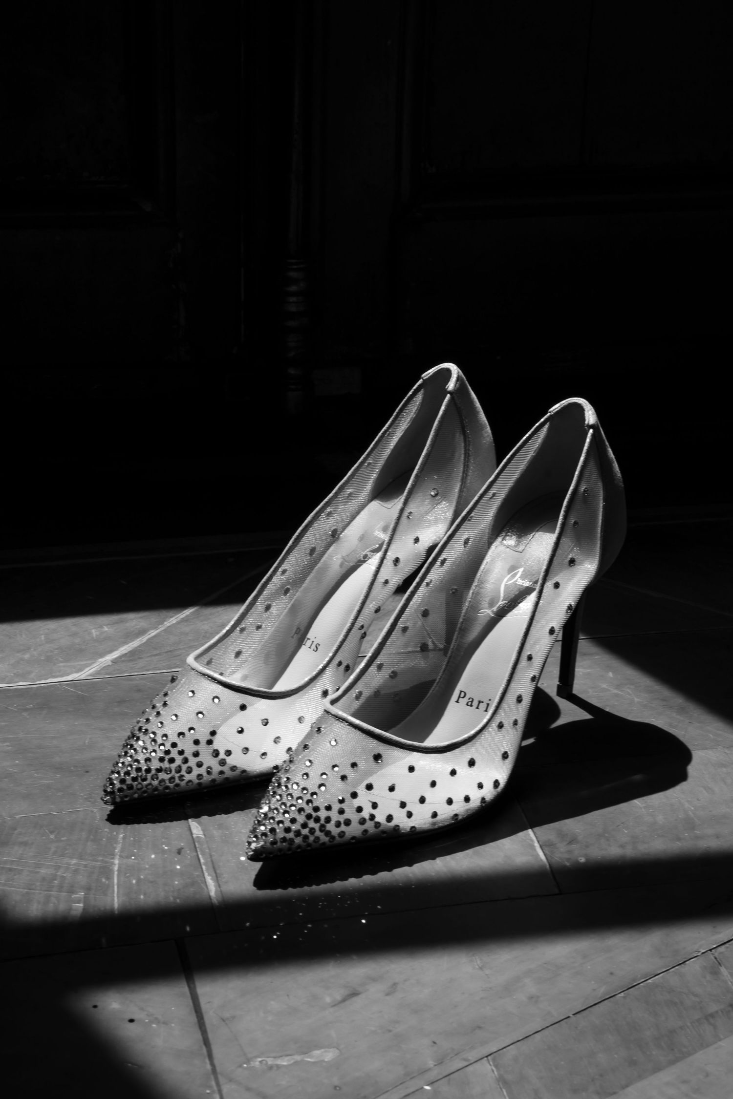 Artistic black and white photo series showing elegant crystal-studded high heel shoes in dramatic lighting and shadows.