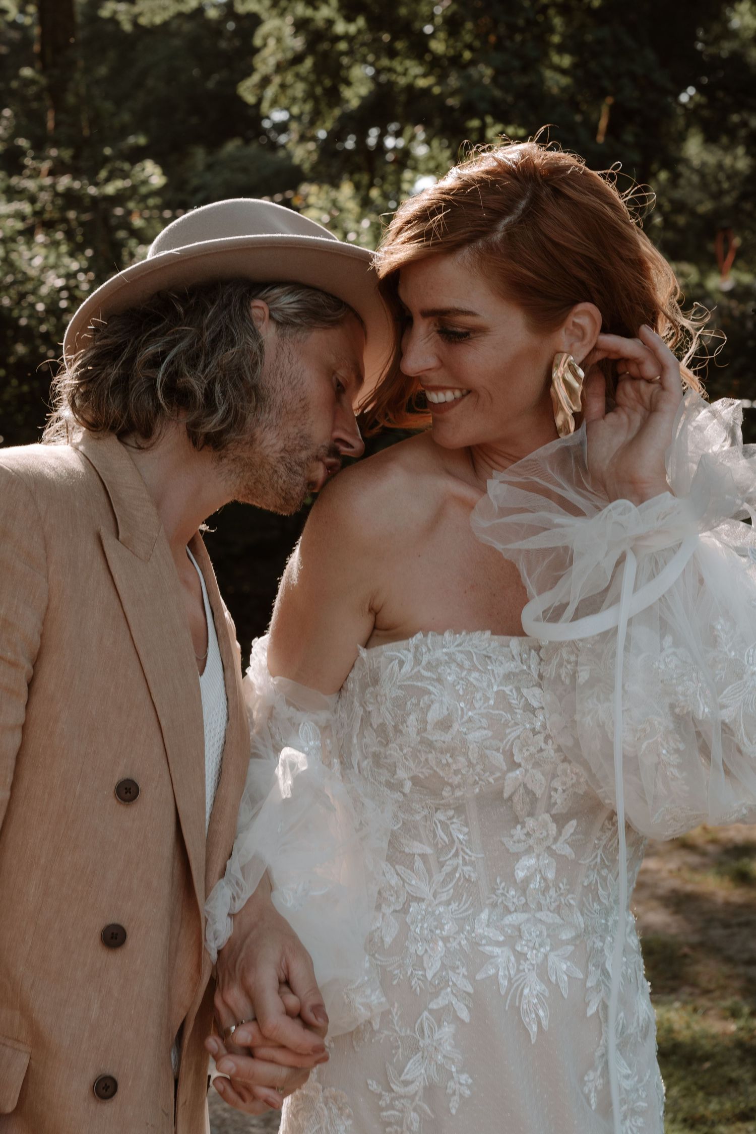 Close-up wedding portrait showing tender intimate moments between newlyweds.