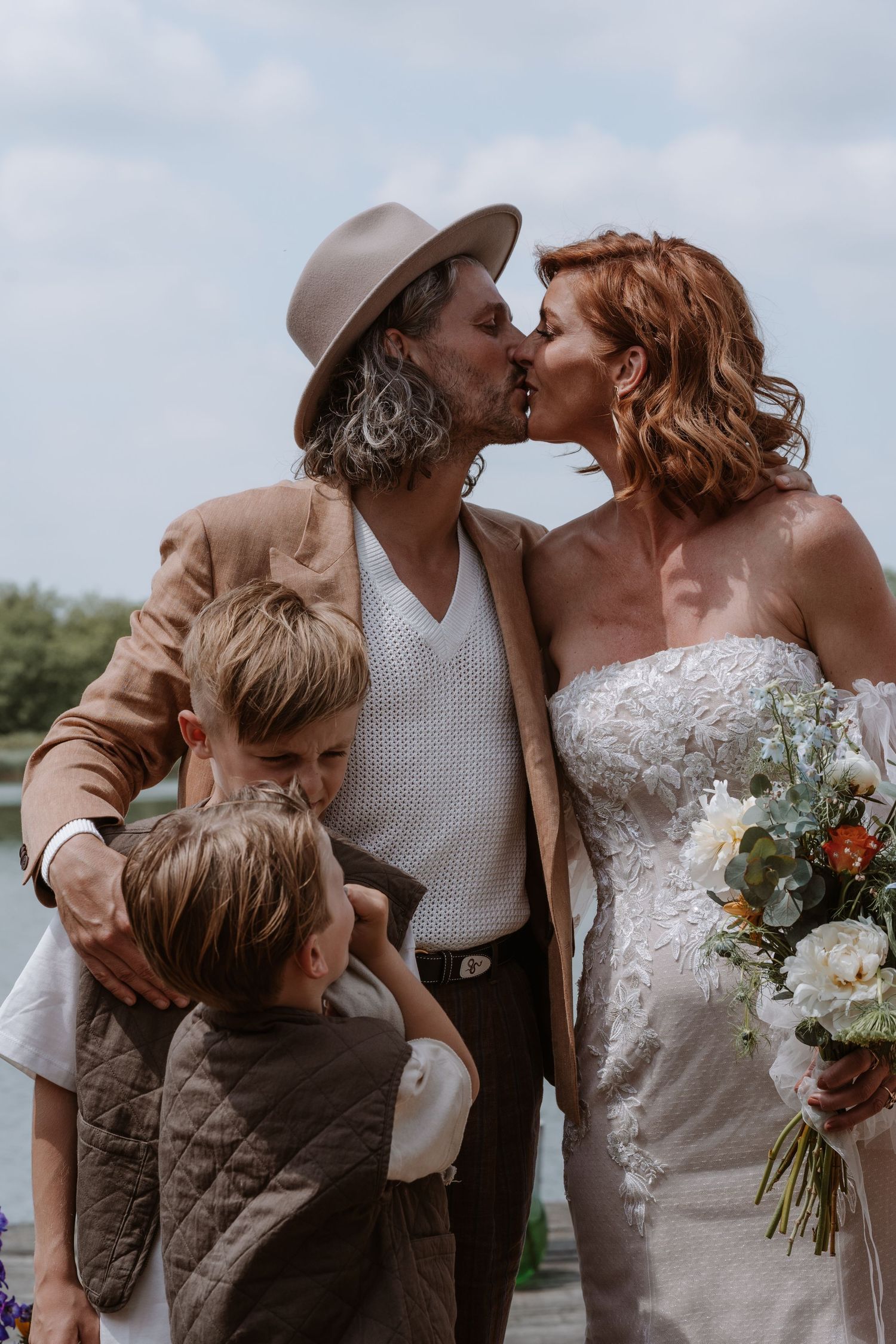 Intimate wedding moments captured with couple and family in vintage-inspired attire.