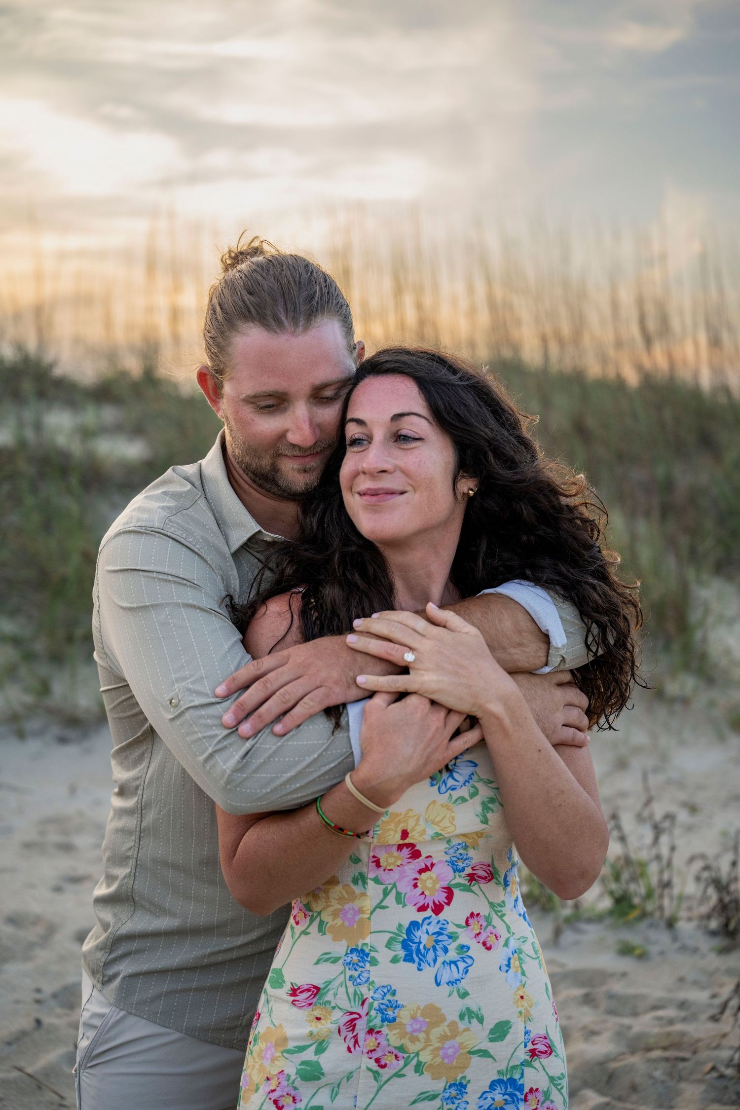 Couple posing together on Tybee Island, Georgia, at golden hour during a romantic couples photography session.