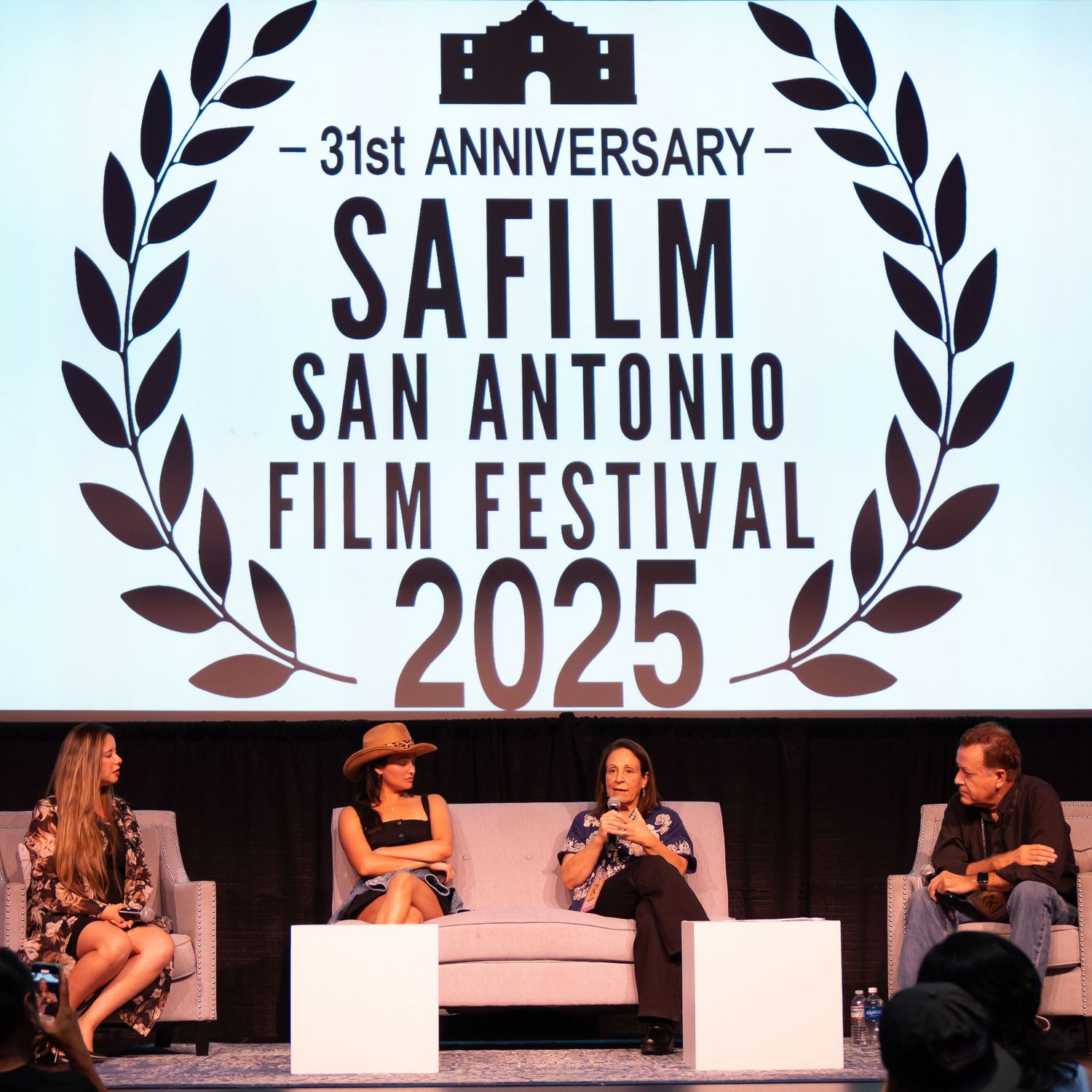 Director speaking on stage at San Antonio film festival, captured by Ten X Captures for event photography and video portfolio.