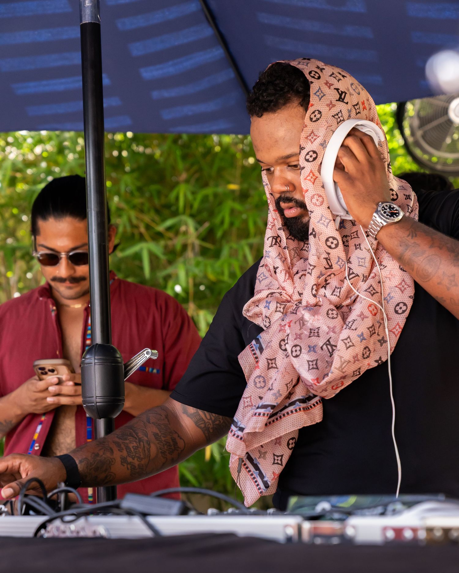 DJ performing at DJ booth during Austin event, captured by Ten X Captures for event photography and video portfolio.