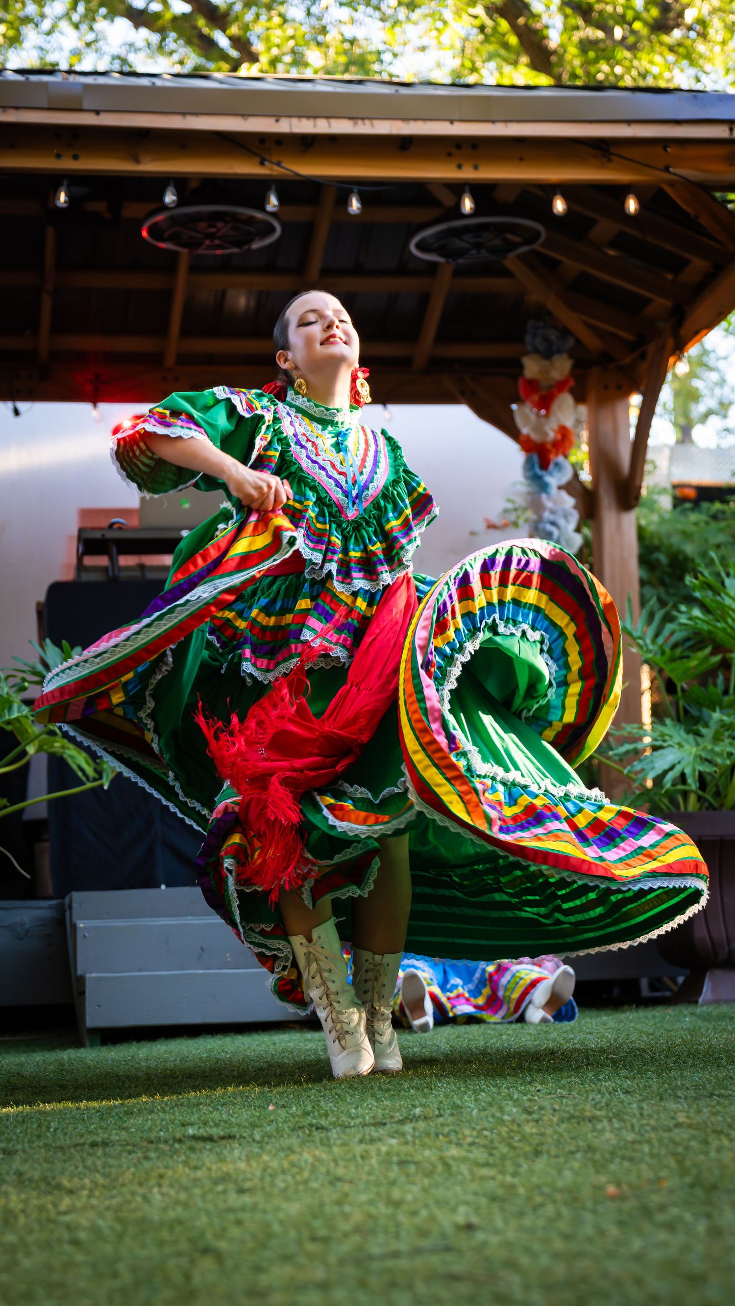 Folklorico dancer in colorful dress performing at San Antonio event, captured by Ten X Captures for event photography and video.
