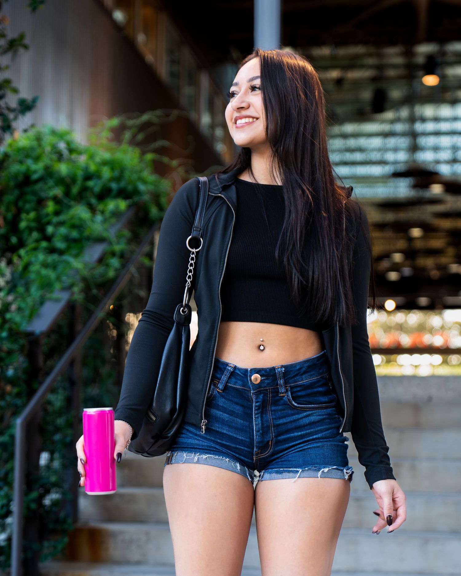 Personal portfolio photoshoot by Ten X Captures featuring female model holding a can walking downstairs and smiling outdoors in San Antonio.