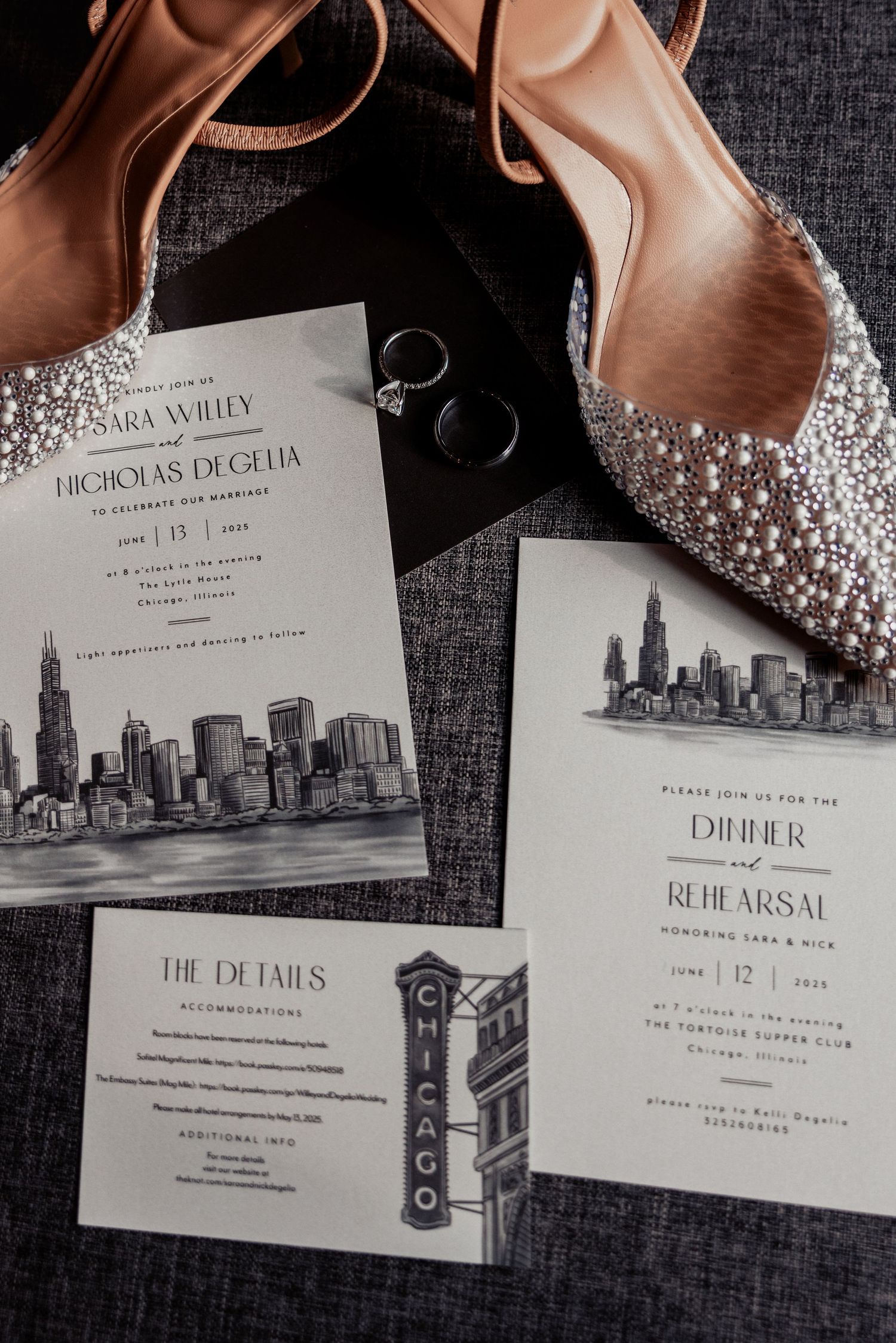 Elegant Chicago-themed wedding invitation set with pearl embellished heels and wedding rings.