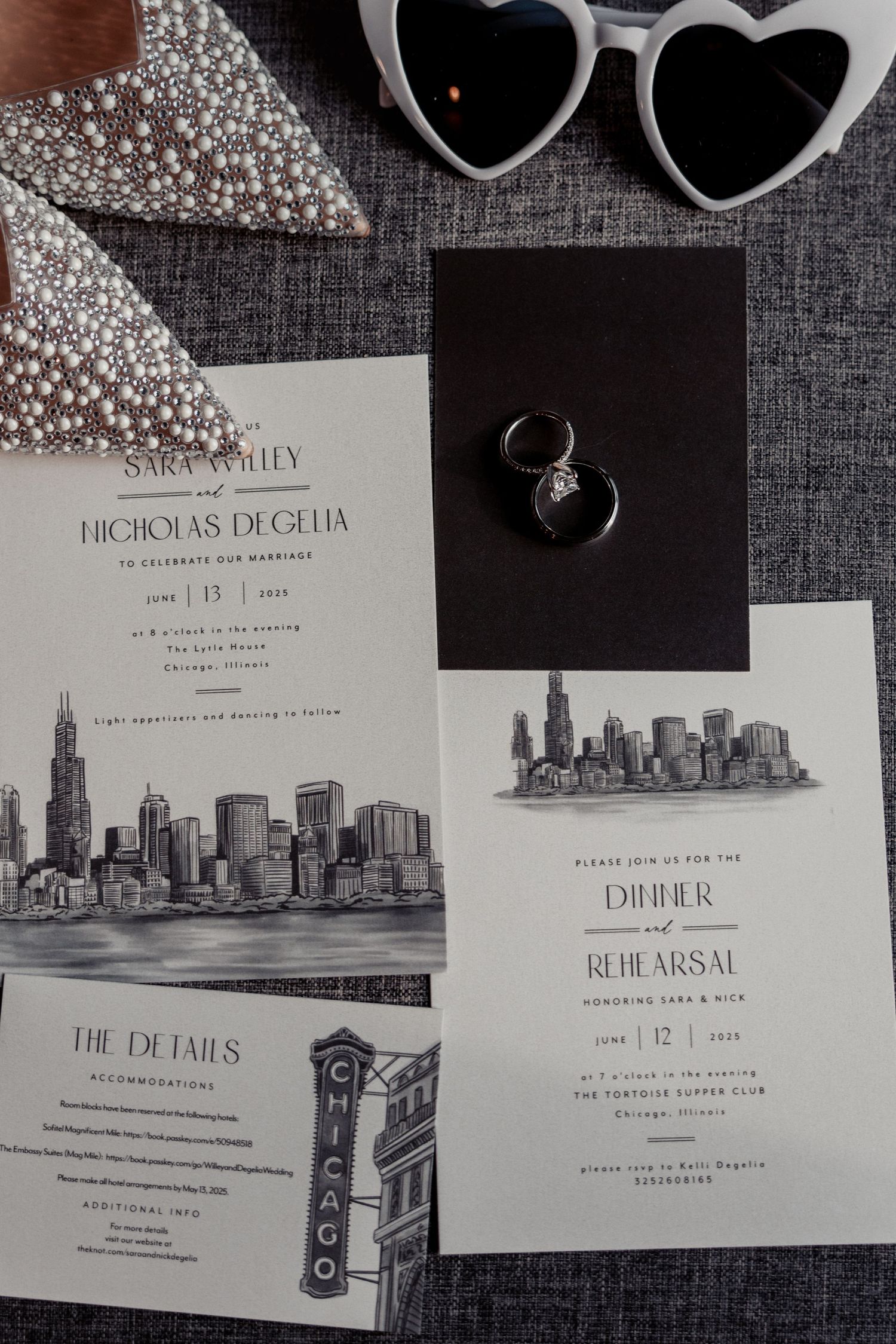 Chicago skyline wedding stationery suite with rings, heart sunglasses, and pearl bridal heels.