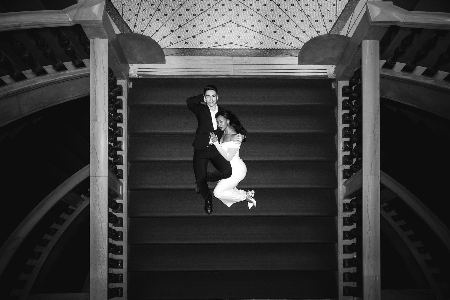 Aerial black and white photo of bride and groom posing on a grand staircase.Chicago Wedding Photographer