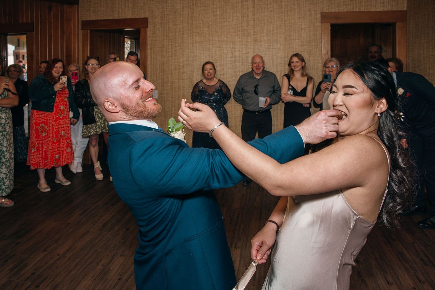 Joyful bride and groom sharing a lively first dance together at their wedding reception.