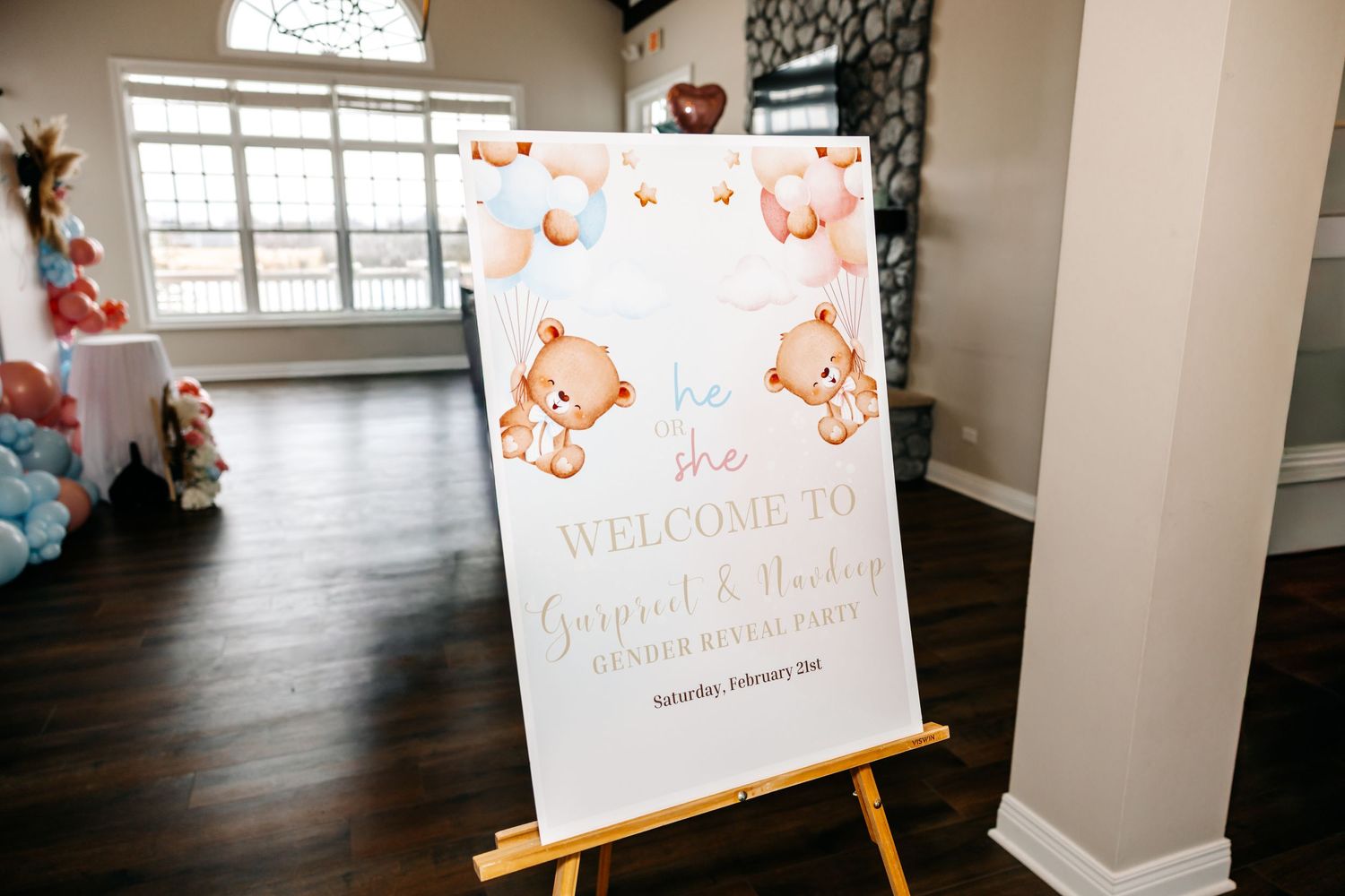 Welcome sign on easel for Gurpreet and Shelley gender reveal party with cute bear illustrations.