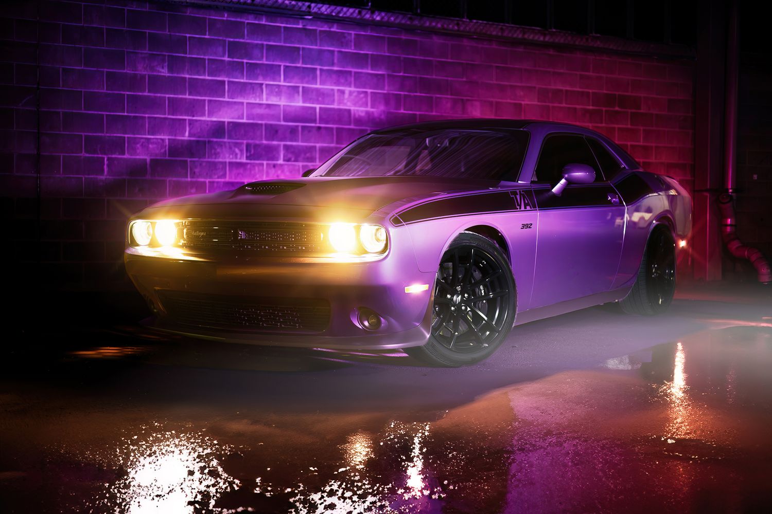 A purple Dodge Challenger illuminated by neon lights in a wet parking garage at night