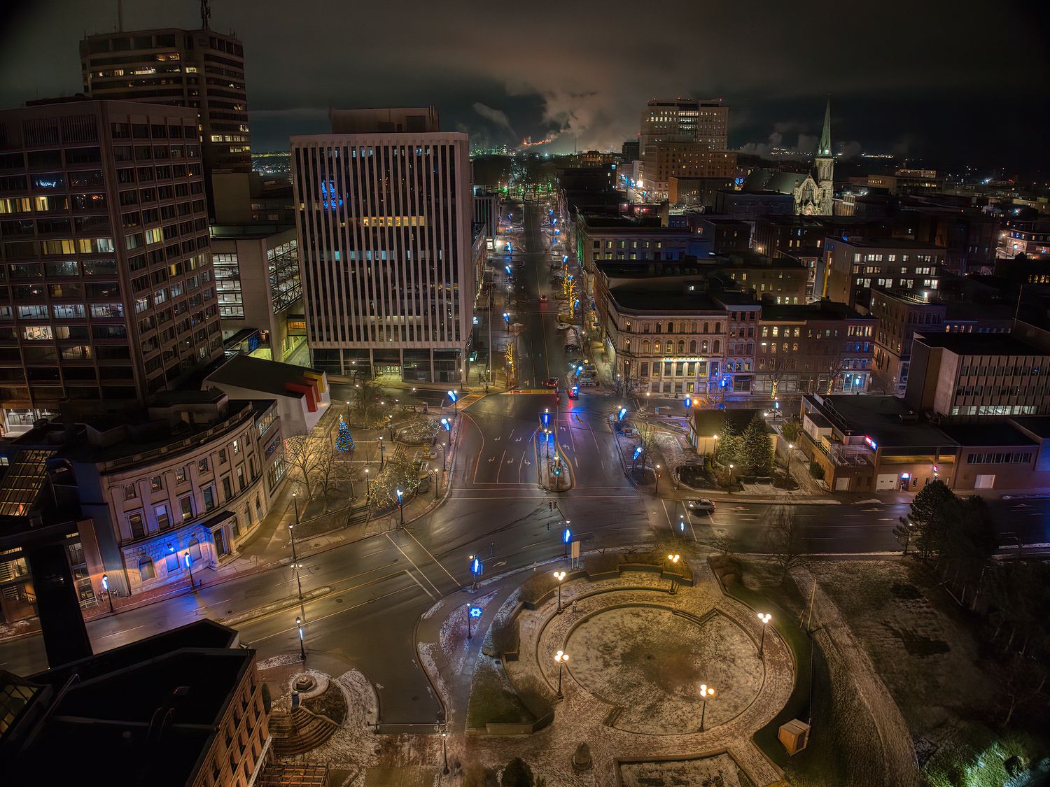 Panoramic cityscape at night showing illuminated streets and buildings from an elevated perspective. bottom of king st in Saint John, NB.