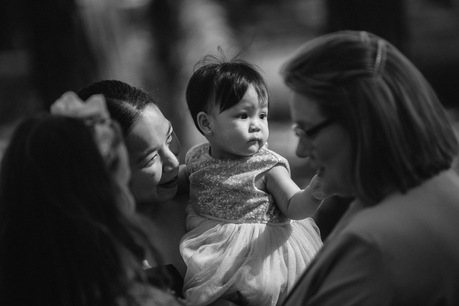 A tender black and white moment captured during a wedding celebration.