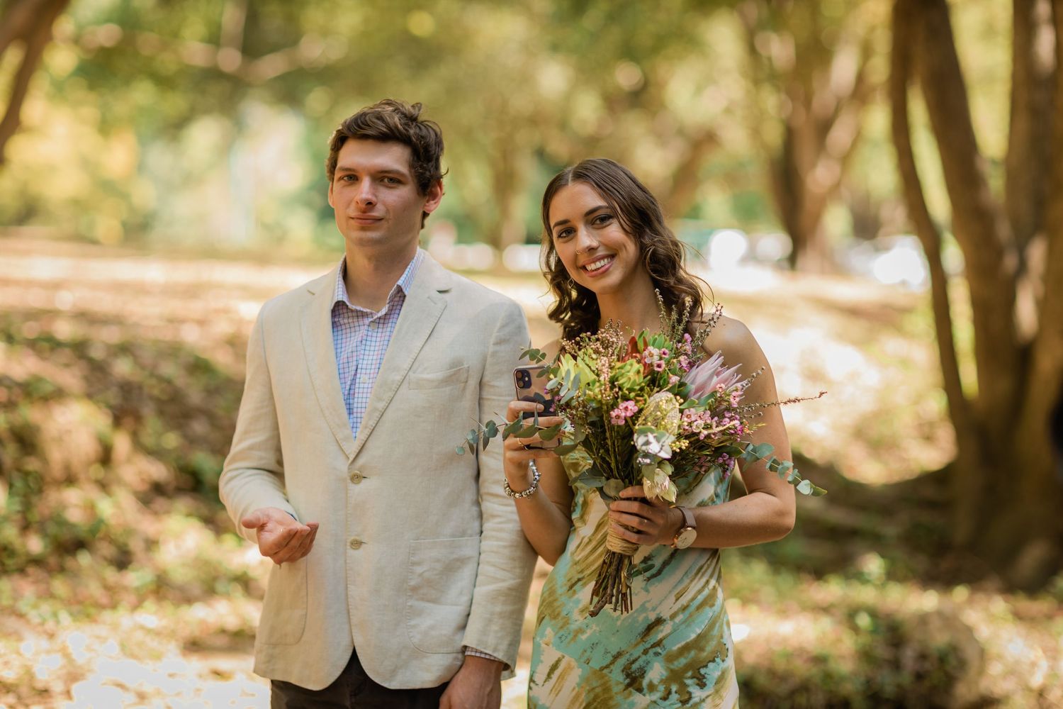 Couple shares a joyful moment during their woodland wedding ceremony.Currumbin Valley wedding photography Gold Coast