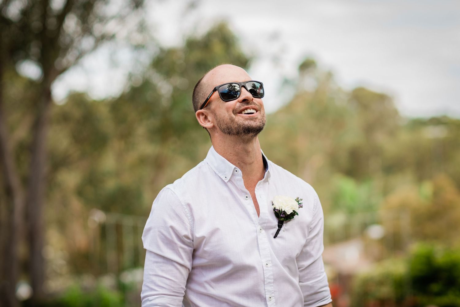 Wedding guests in formal attire enjoying an outdoor celebration.Gold Coast beach wedding photography